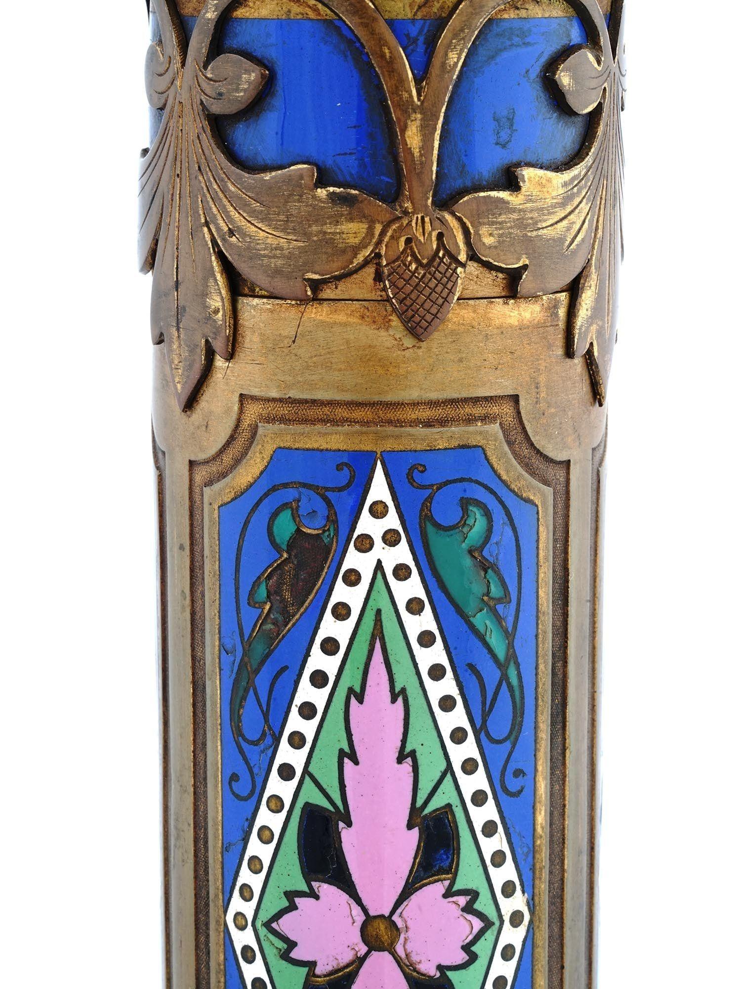 Unique and rare bronze column-form table lamp with blue and pink floral champleve enamel designs on square base with foliate motifs. Attributed to Edward F. Caldwell, circa 1910s.  With sockets and wiring, ready for use.