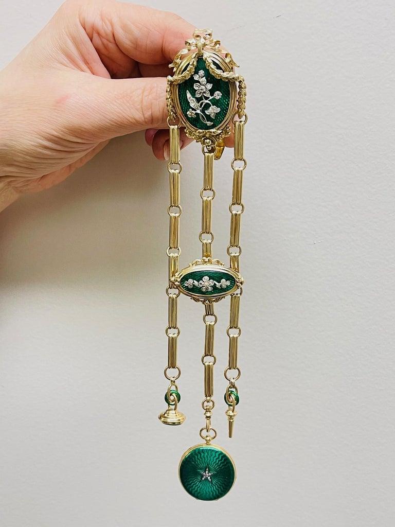 Simply Beautiful! Finely detailed High Quality Antique French 18 Karat Gold Enamel Châtelaine, suspending fob, key and watch with white enamel dial and Roman numerals. Champlevé Green Enamel, Hand set with decorative Diamond design. Approx.
