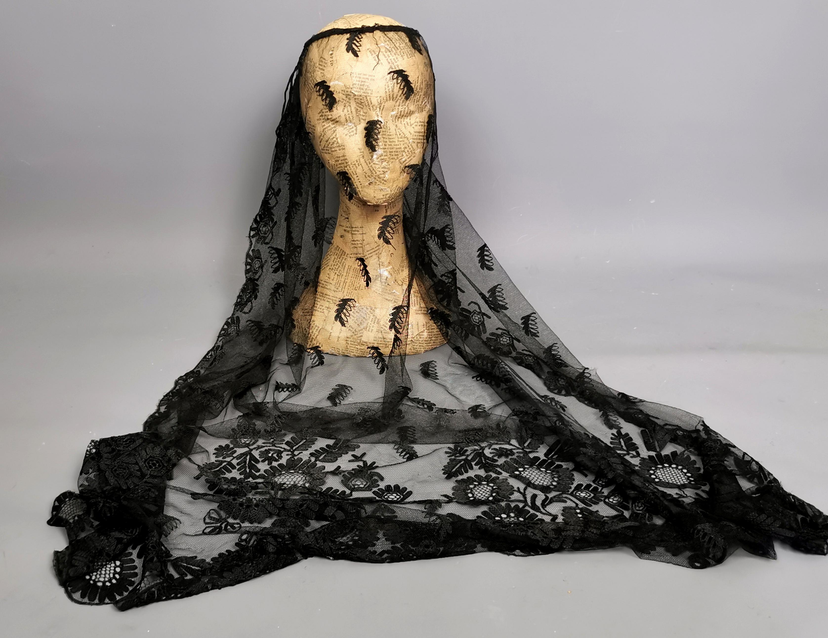 A beautiful antique, early Victorian chantilly lace mourning veil.

A long fine net lace with floral embroidered trim and decorative edging.

It has the original ties, designed to be affixed to a raised mourning bonnet and to cover the face.

A very