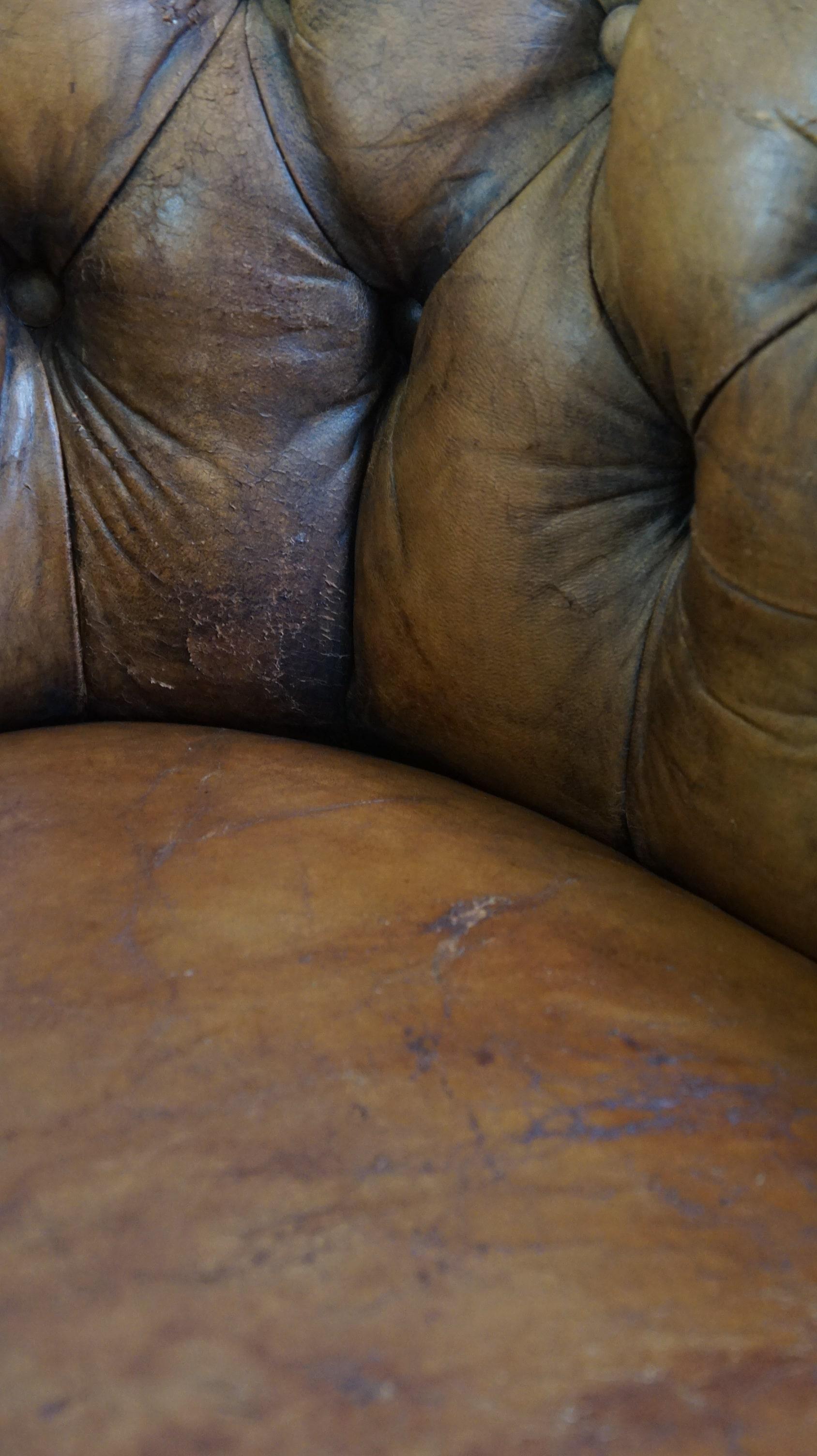 Antique, characteristic sheepskin chesterfield club chair on wheels For Sale 6