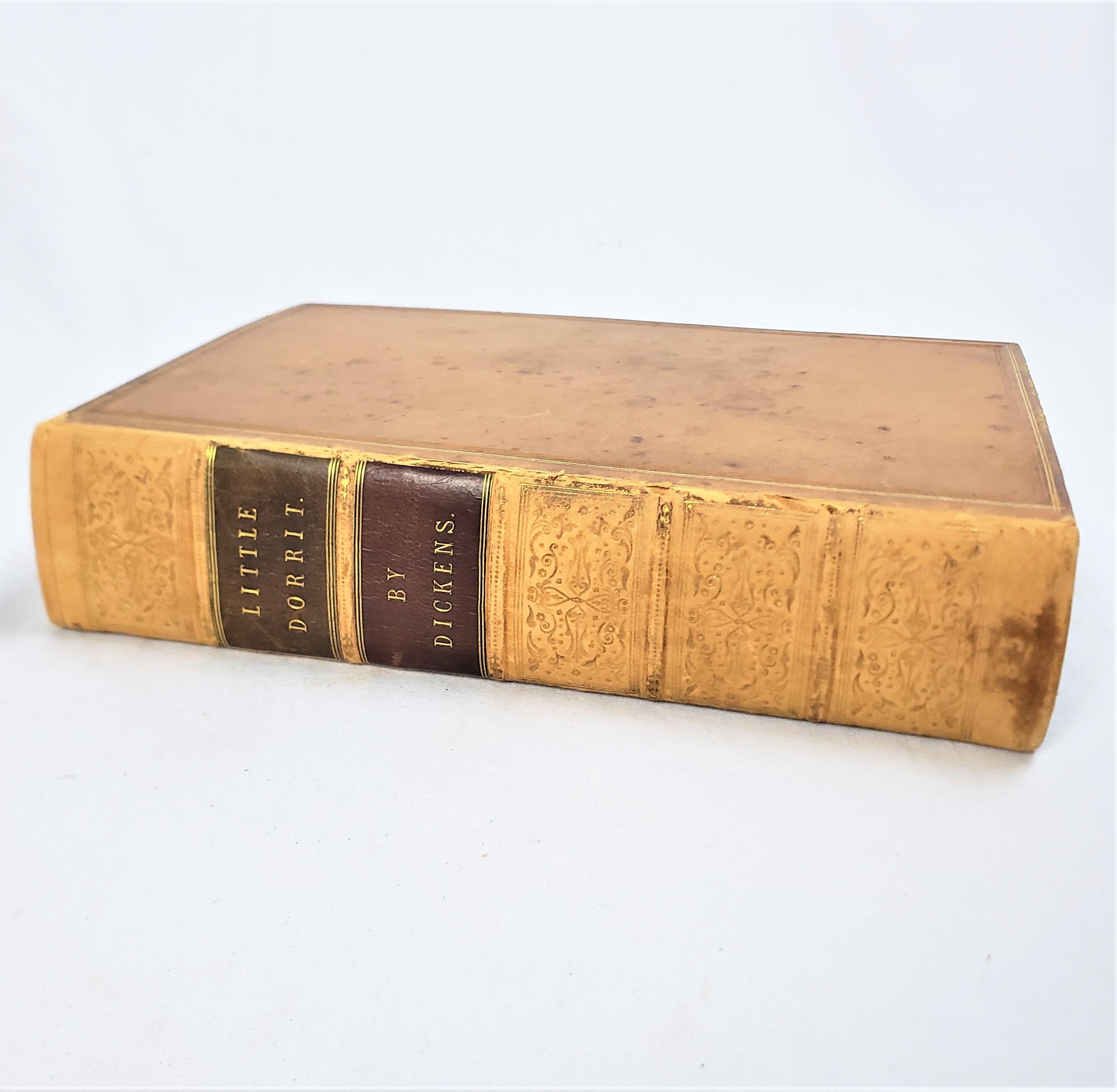This antique 1st edition book titled Little Dorrit was authored by Charles Dickens and published by Chapman and Hall of England in 1857 in the period Victorian style with etchings by Hablot Knight Browne 