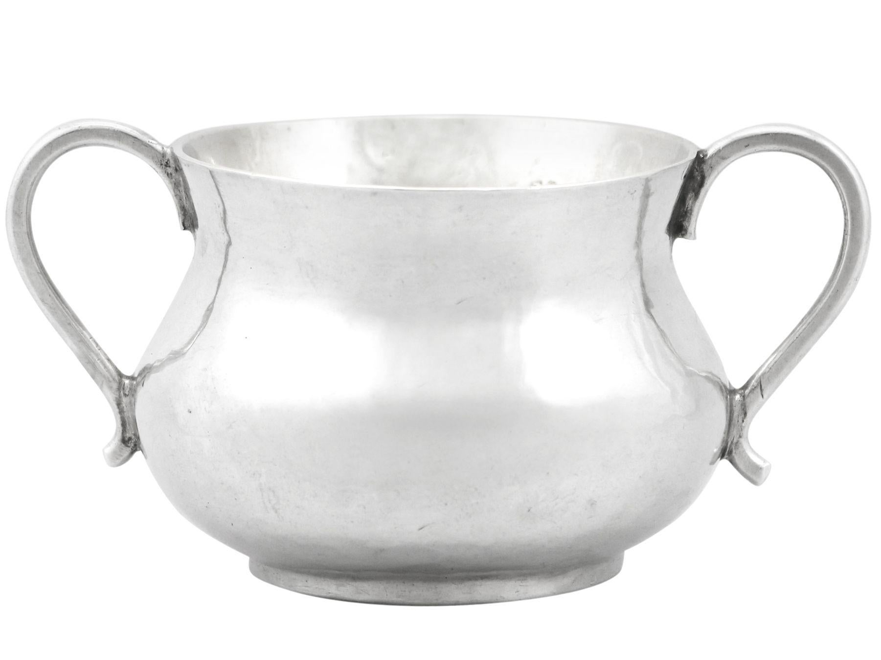 An exceptional, fine and impressive, rare antique Charles II English sterling silver baby porringer; part of our collectable silverware collection.

This exceptional antique Charles II sterling silver baby porringer has a circular rounded form