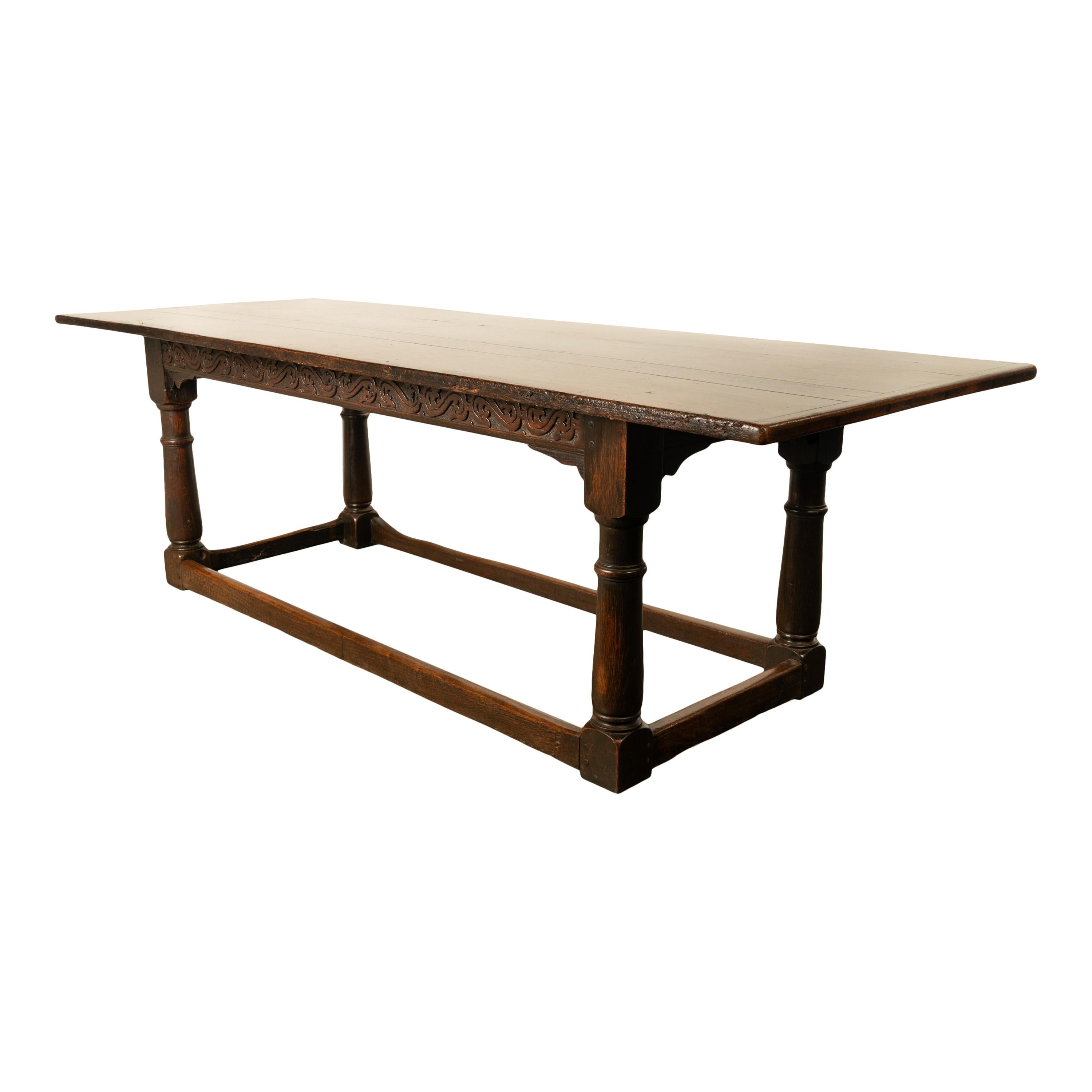 Antique English carved oak refectory dining table, circa 1680.
A fine and large oak refectory table from the reign of King Charles II and the restoration of the monarcht after the English Civial War. The planked top sits above a carved skirt the