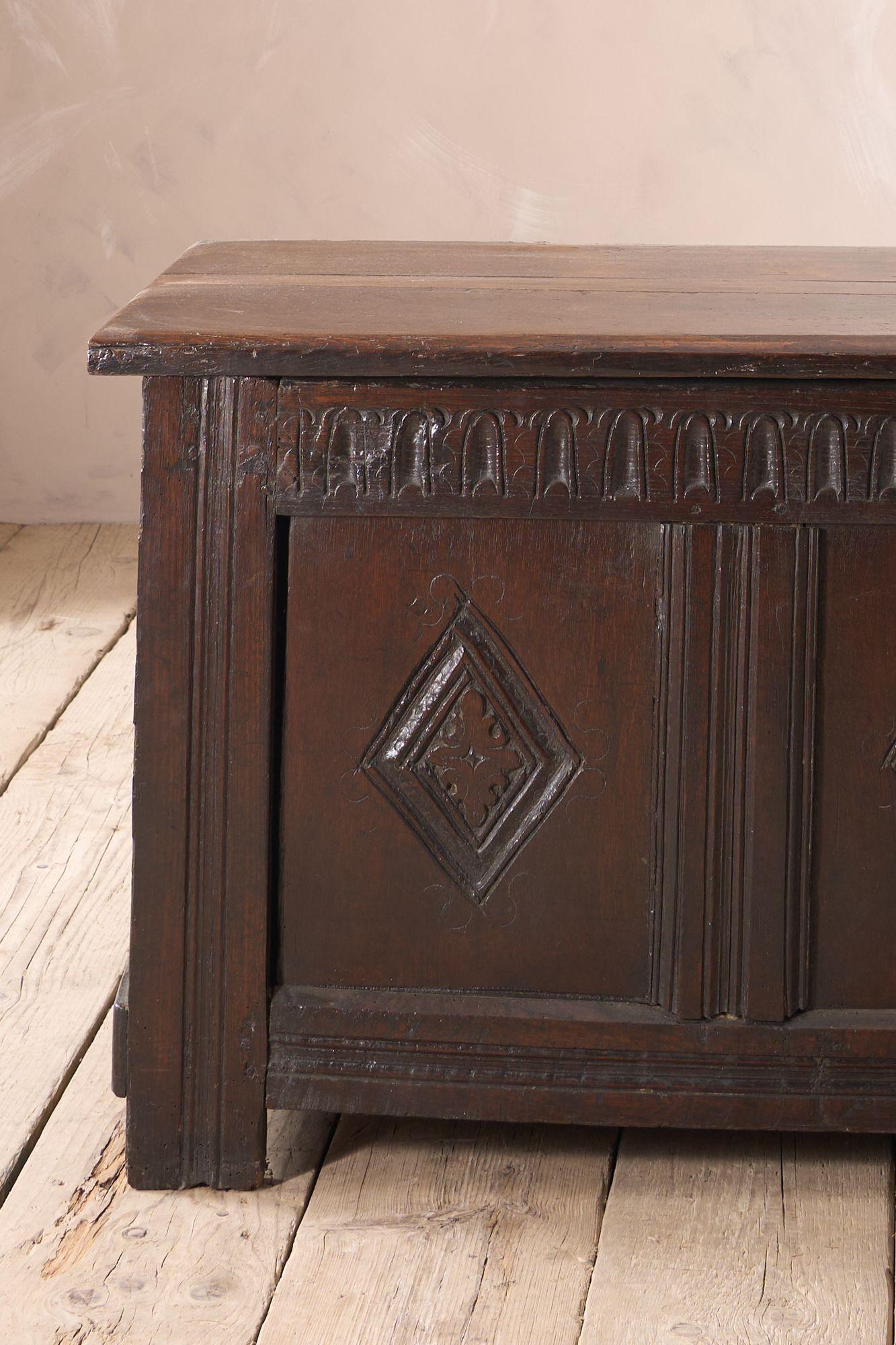 This is a very nice quality solid oak coffer from the Charles II period (1630-1685). It is in great overall condition with carved details to the front. The lis has strong iron hinges that are still in place. The interior is also painted and colour