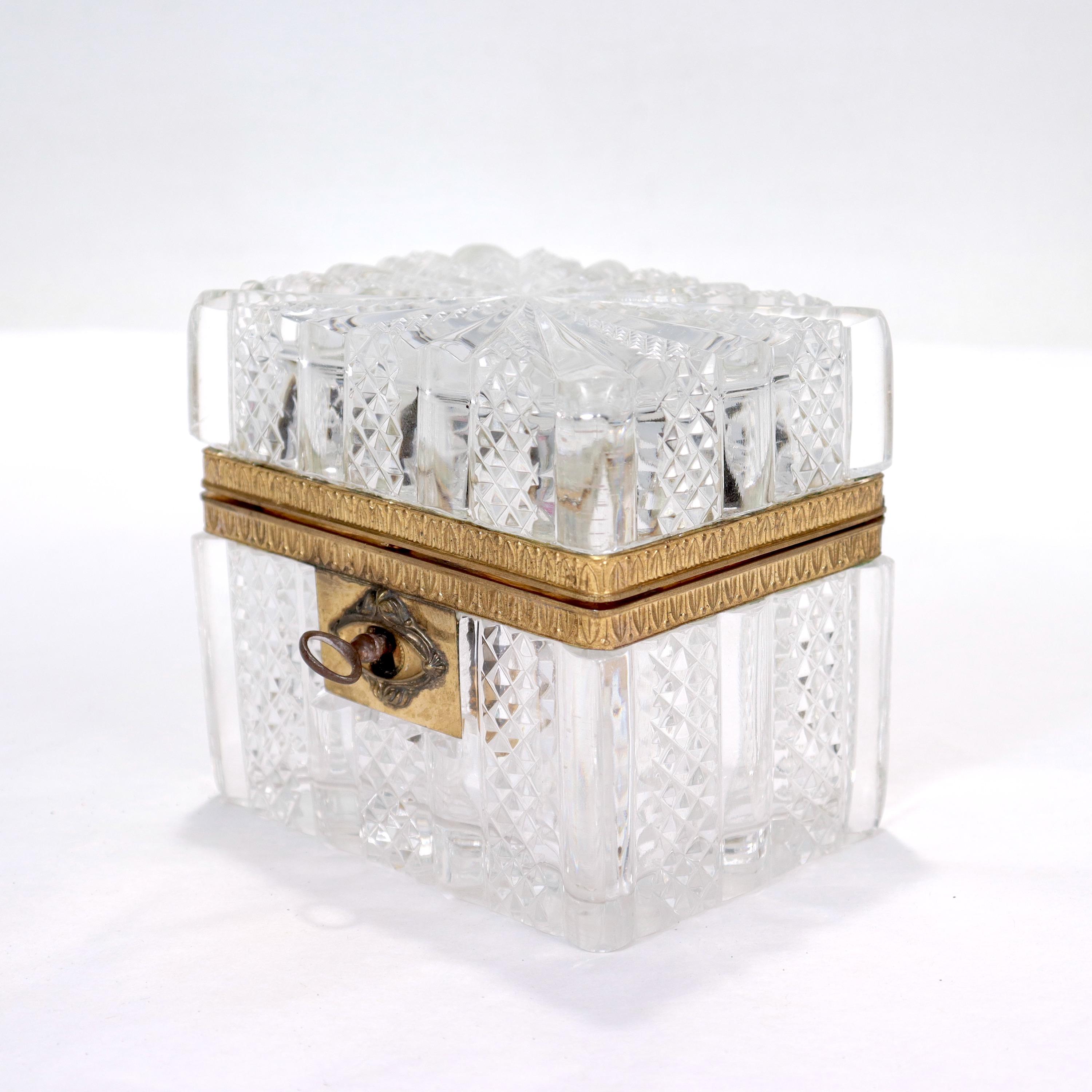A fine antique French cut glass casket.

With a pressed and cut glass body and cover with a gilt bronze mount.

Together with an associated key (for a nonfunctional lock).

Simply a great French cut glass casket!

Date:
Early 19th Century

Overall