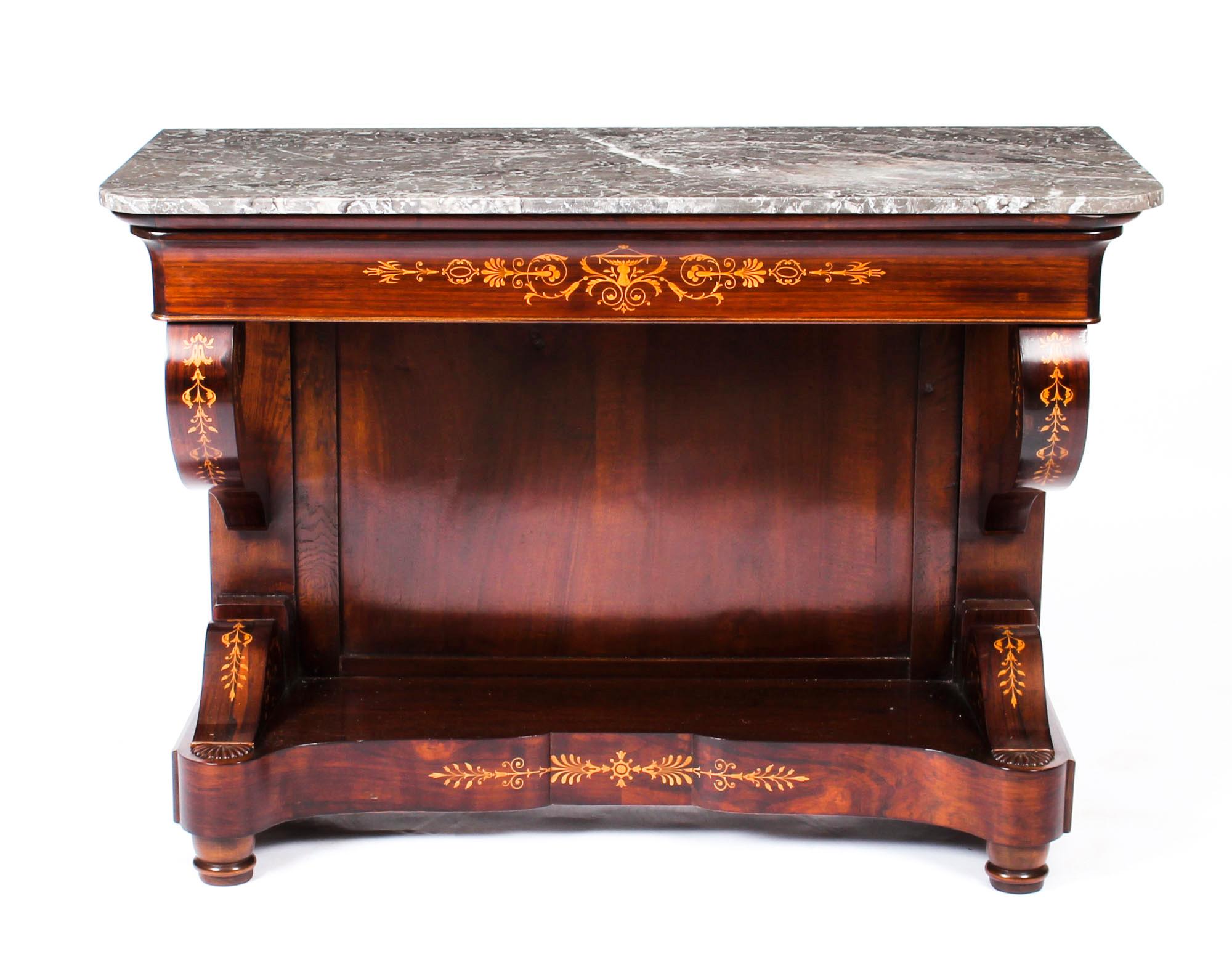 This is a very elegant antique French Charles X period finely figured tigerwood console table, circa 1830 in date.

This wonderful console table retains its original Gris St Anne marble top has a useful frieze drawer and stands on curvaceous