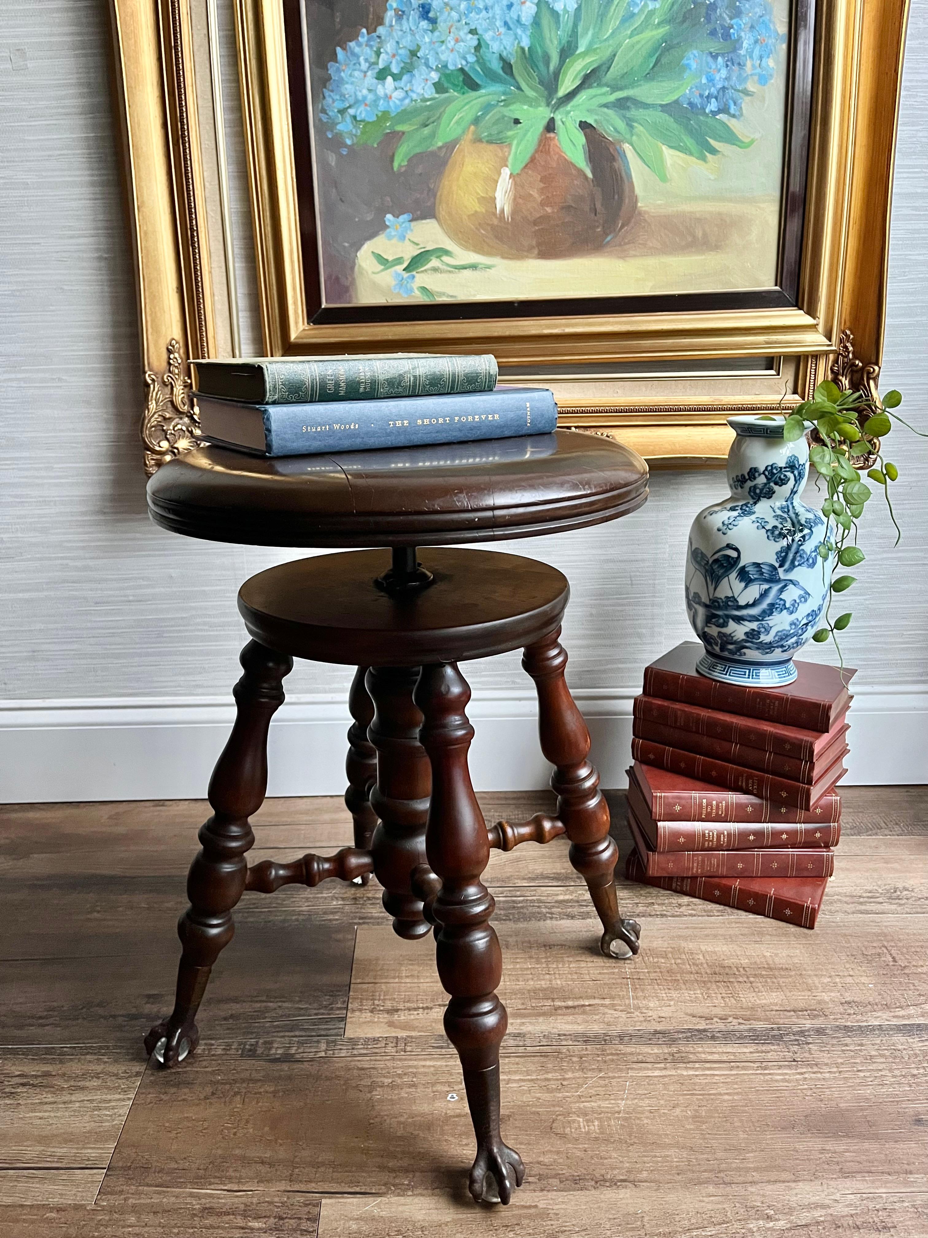 Dimensions:
Fully raised: 22” tall apx
Standard Height: 18” tall apx

This exquisite Victorian-era Chas Parker piano stool, crafted in Meriden, CT, combines timeless design with functional elegance. Featuring a spinning seat for easy adjustment and
