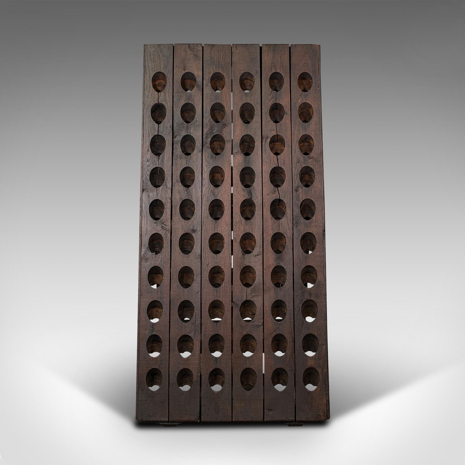 This is an antique chateau champagne riddler. A French, oak 120-bottle wine rack, dating to the early Victorian period, circa 1850.

Generously sized riddler with French country house appeal.
Displays a desirable aged patina and in good original