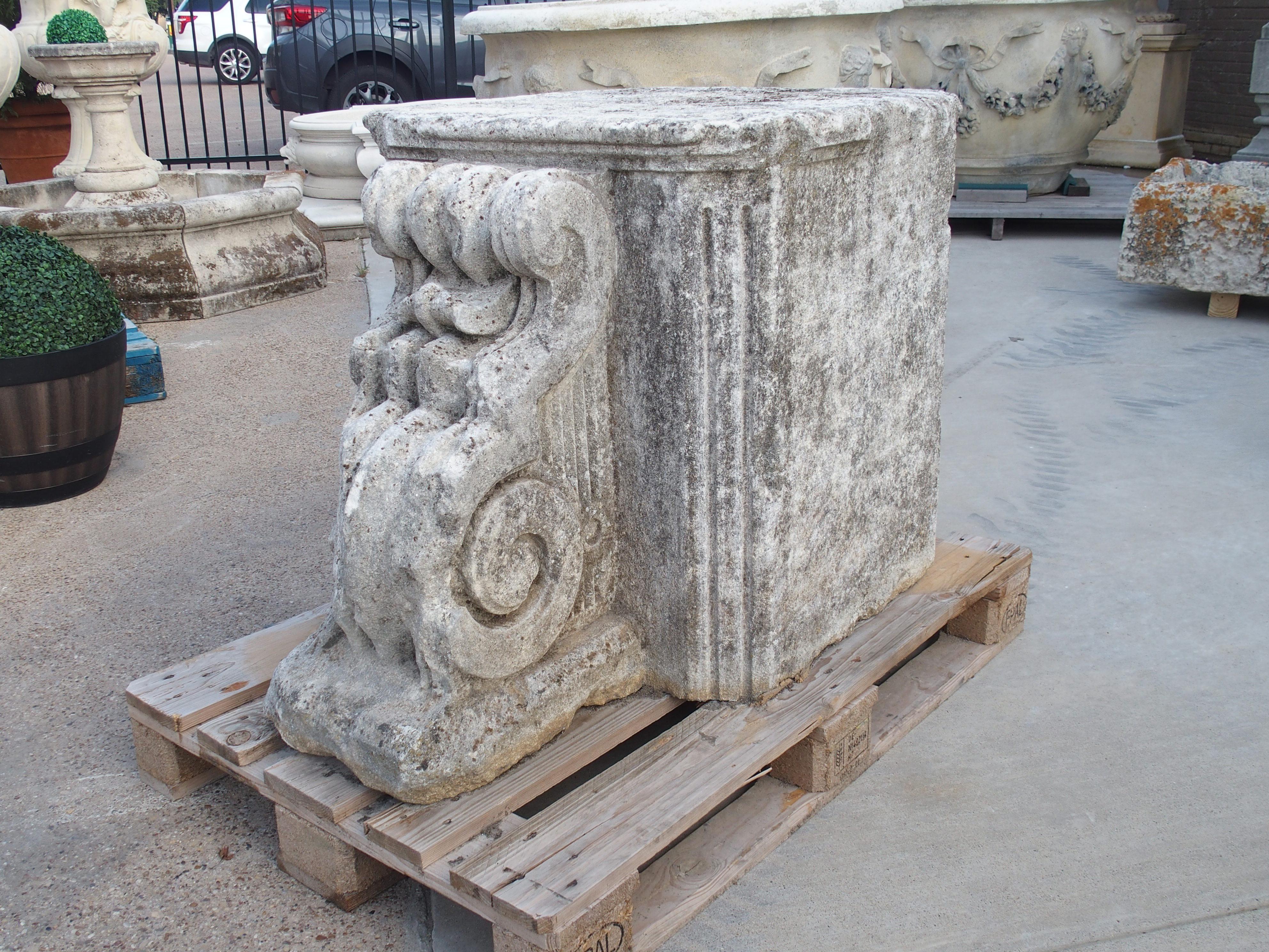 Truly a one-of-a-kind offering, this chateau column base was hand-carved in Dijon, France, circa 1750, making it a Louis XV period architectural. Carved from a single block of limestone, the robust column boasts canted edges adorned with elegant