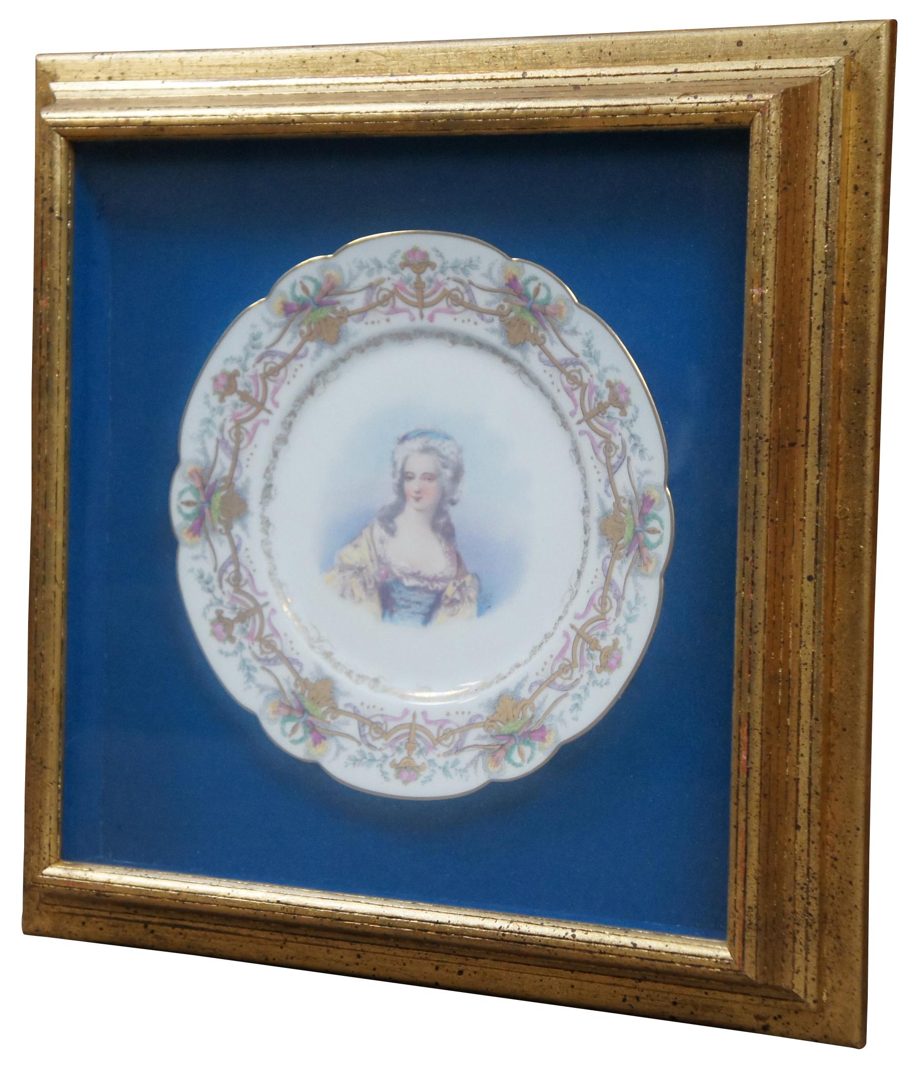 Framed antique 19th century sevres porcelain plate by Chateau des Tuileries featuring a portrait of a noblewoman framed by pink and gold torches and flowers.

Measures: 15.75” x 2.25” x 15.75” / Plate diameter – 9” (width x depth x height).