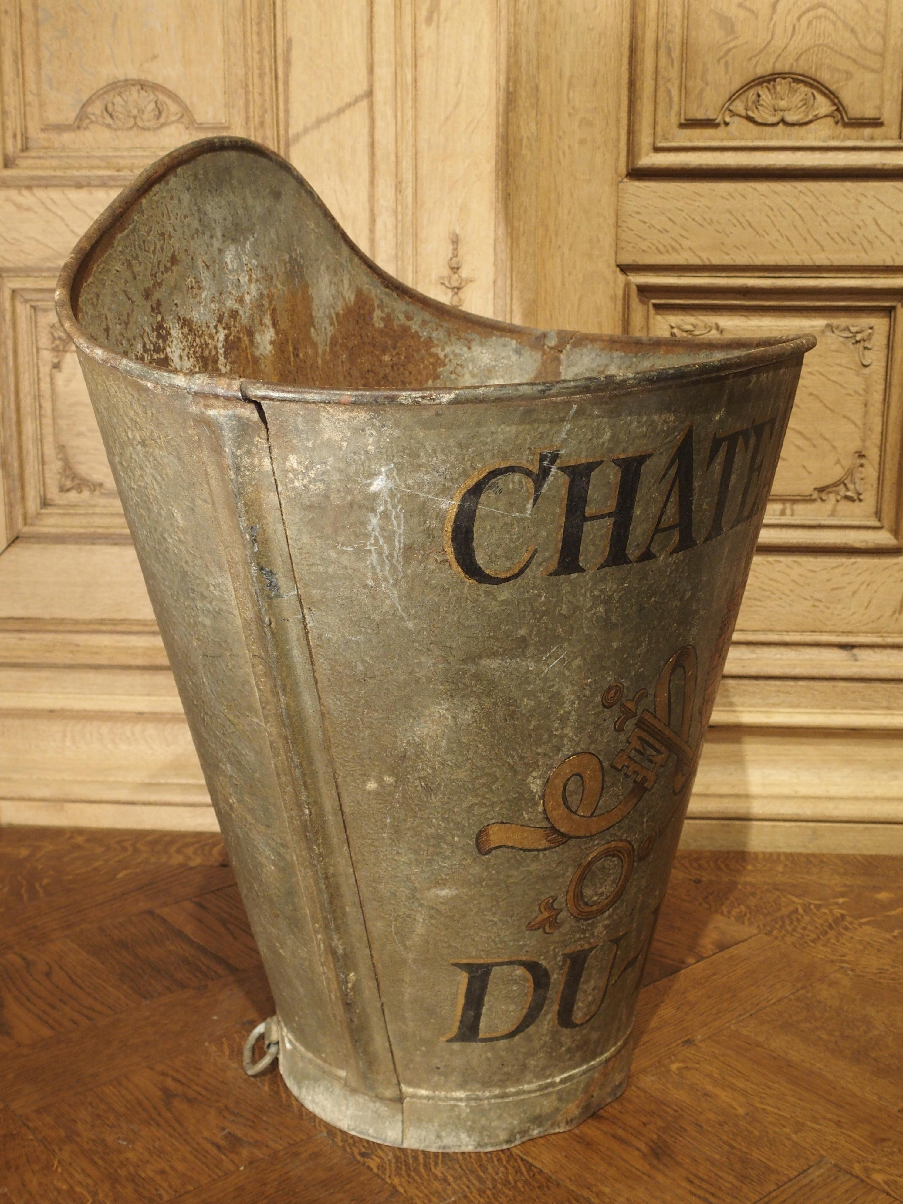 This French metal container is known as an hotte. Hottes were used during the 19th and early 20th centuries for collecting grapes in vineyards. The vineyard employee would attach the hotte to his/her back and place the harvested grapes directly into