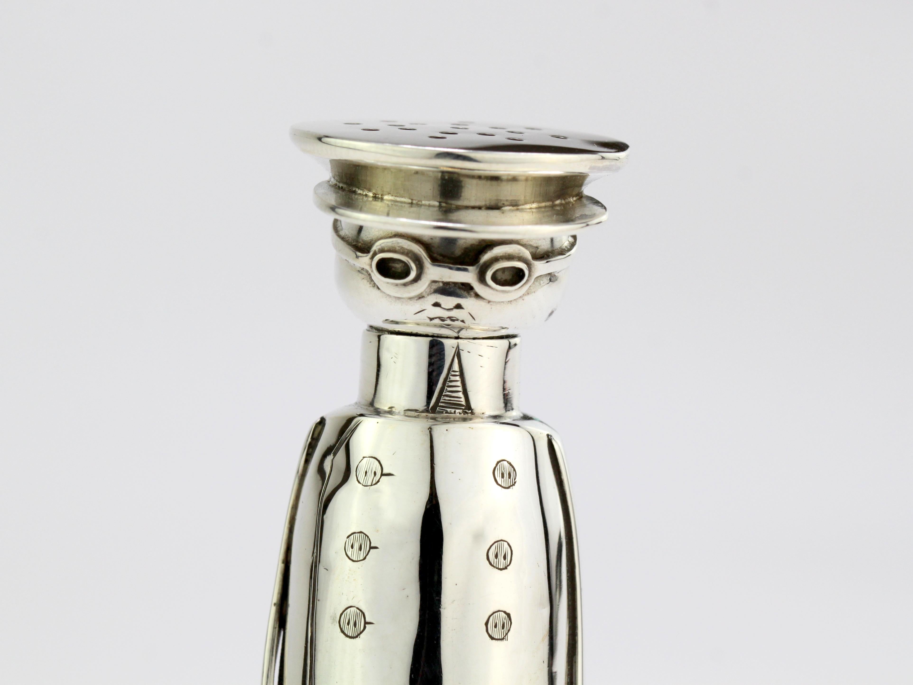 Antique Chauffeur Edwardian novelty silver salt/pepper holder 
Maker: Cornelius Desormeaux and Francis Shepherd
Made in Chester, 1908
Fully hallmarked.

Dimensions - 
Sizes: Diameter by Height: 2.8 x 9.3 cm
Weight: 53 grams