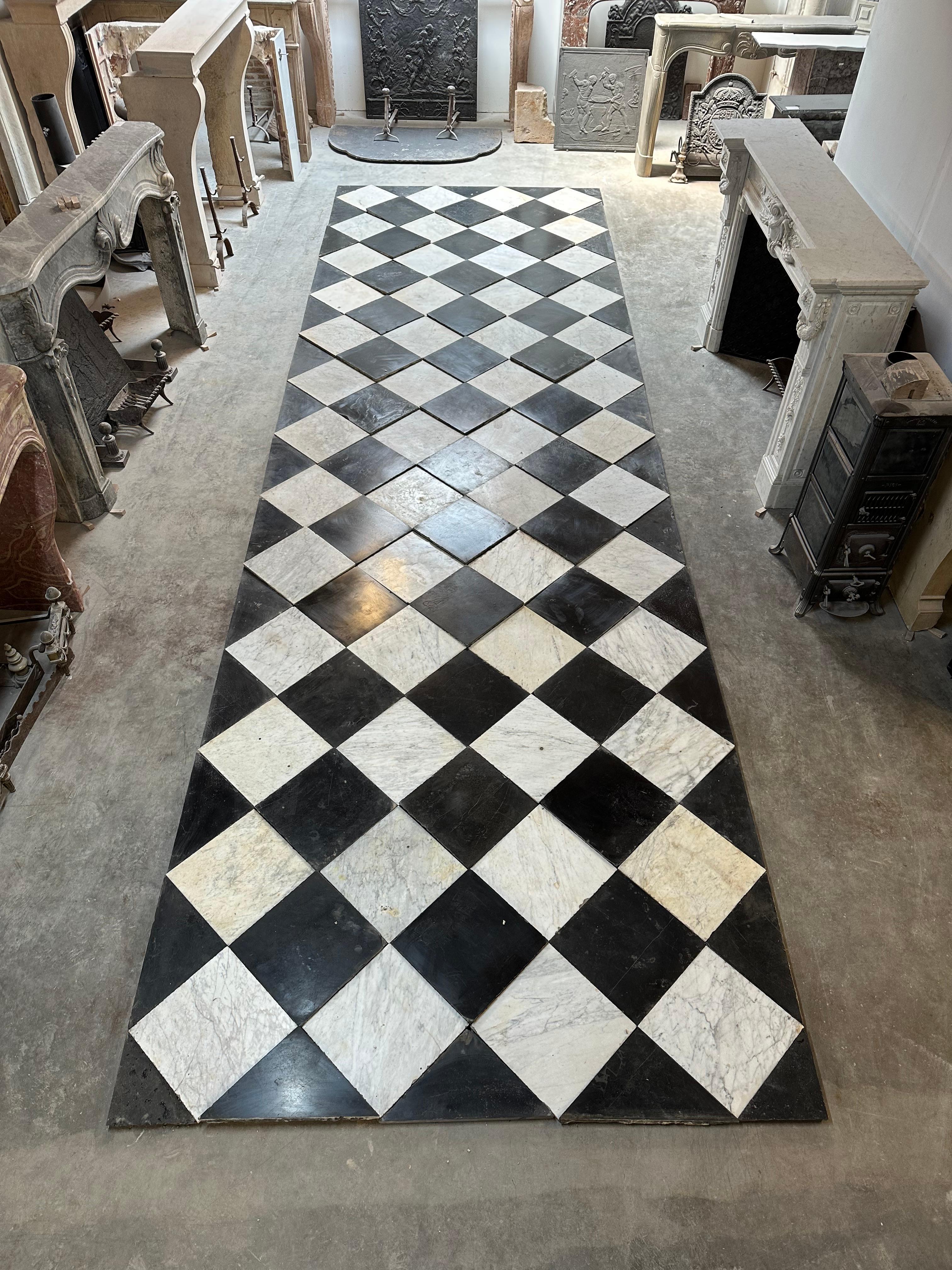 Very pleased to offer this beautiful Dutch checkered marble floor.
This used to be the hallway a small castle near the border with Belgium, the floor dates back to approx. 1835.

The deep dark black Belgian stone come from the area of Namen (Namur)