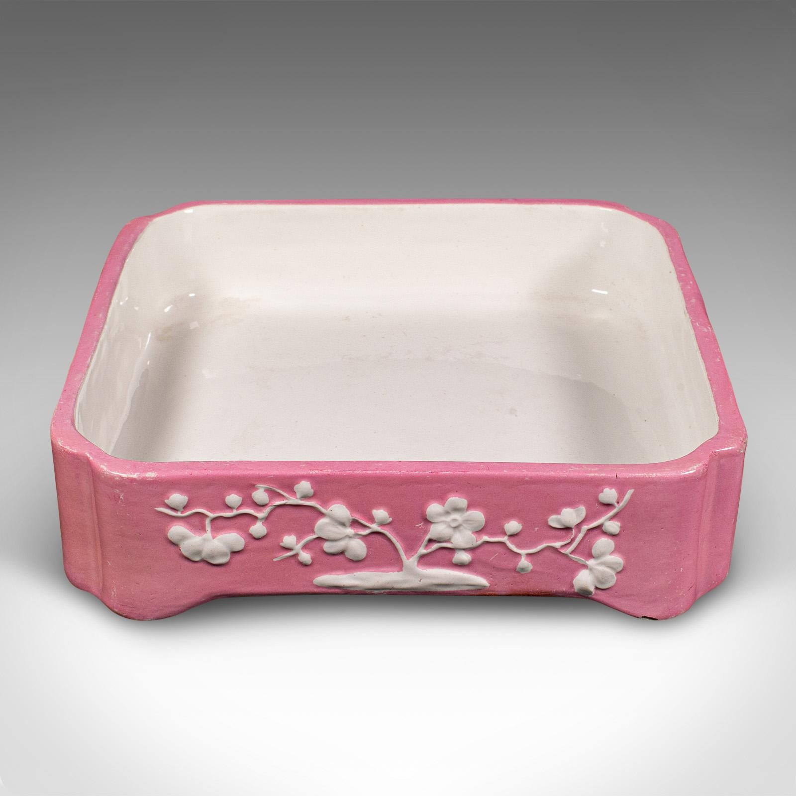 
This is an antique cheese wheel dish. An English, ceramic decorative butter tray, dating to the Victorian period, circa 1870.

Appealing colour and decorative motif, with a cool, tactile nature
Displays a desirable aged patina and in good original