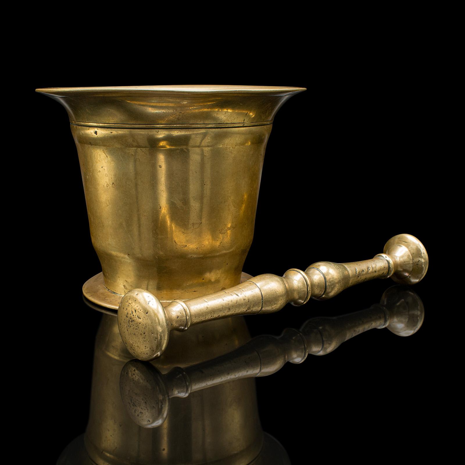 
This is an antique chemist's mortar and pestle. An English, brass apothecary aid, dating to the Victorian period, circa 1850.

Graced with a bright appearance and pleasingly tactile
Displaying a desirable aged patina and in good order