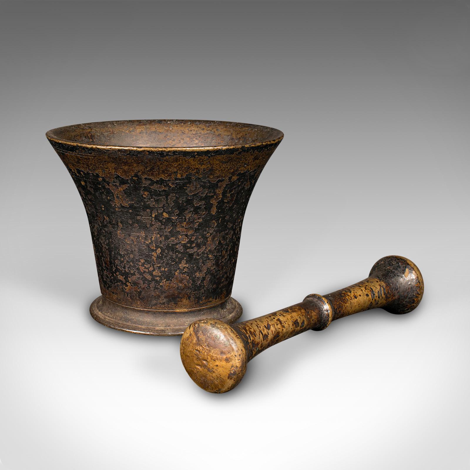 
This is an antique chemist's mortar & pestle. An English, weathered bronze apothecary aid, dating to the early Georgian period, circa 1720.

Superb, 300 year old example with appealing weathering
Displays a desirable, original antique