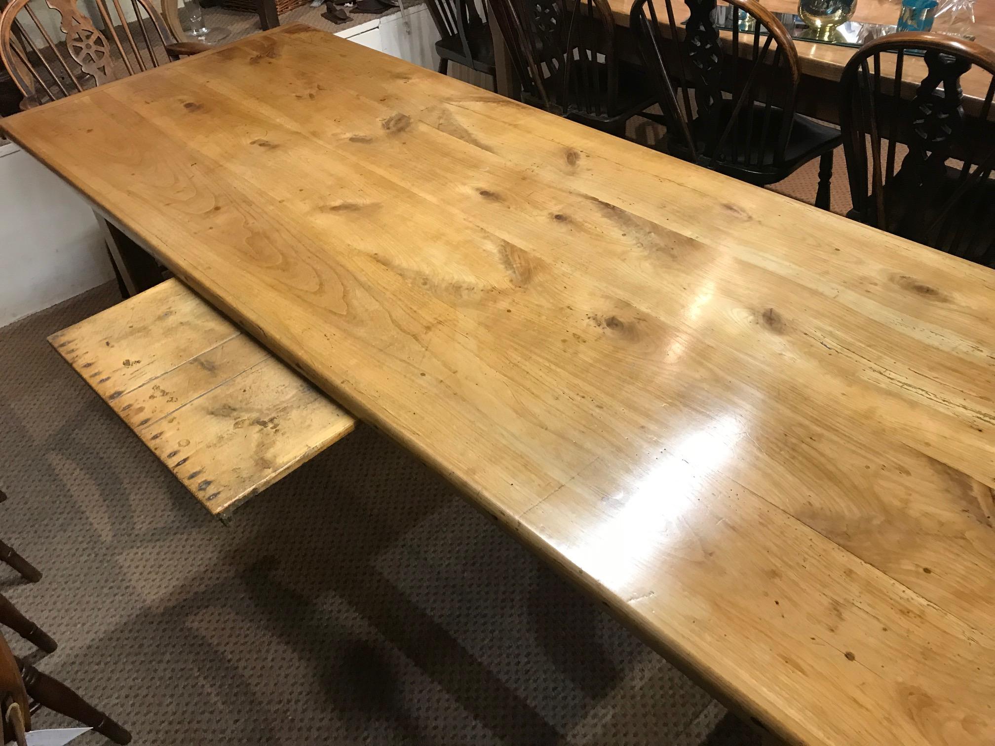 19th century antique cherry farmhouse table with H Stretcher and side bread slide. The table stands on sturdy base with H stretcher ends. Four plank framed top with beautiful colour and patination.