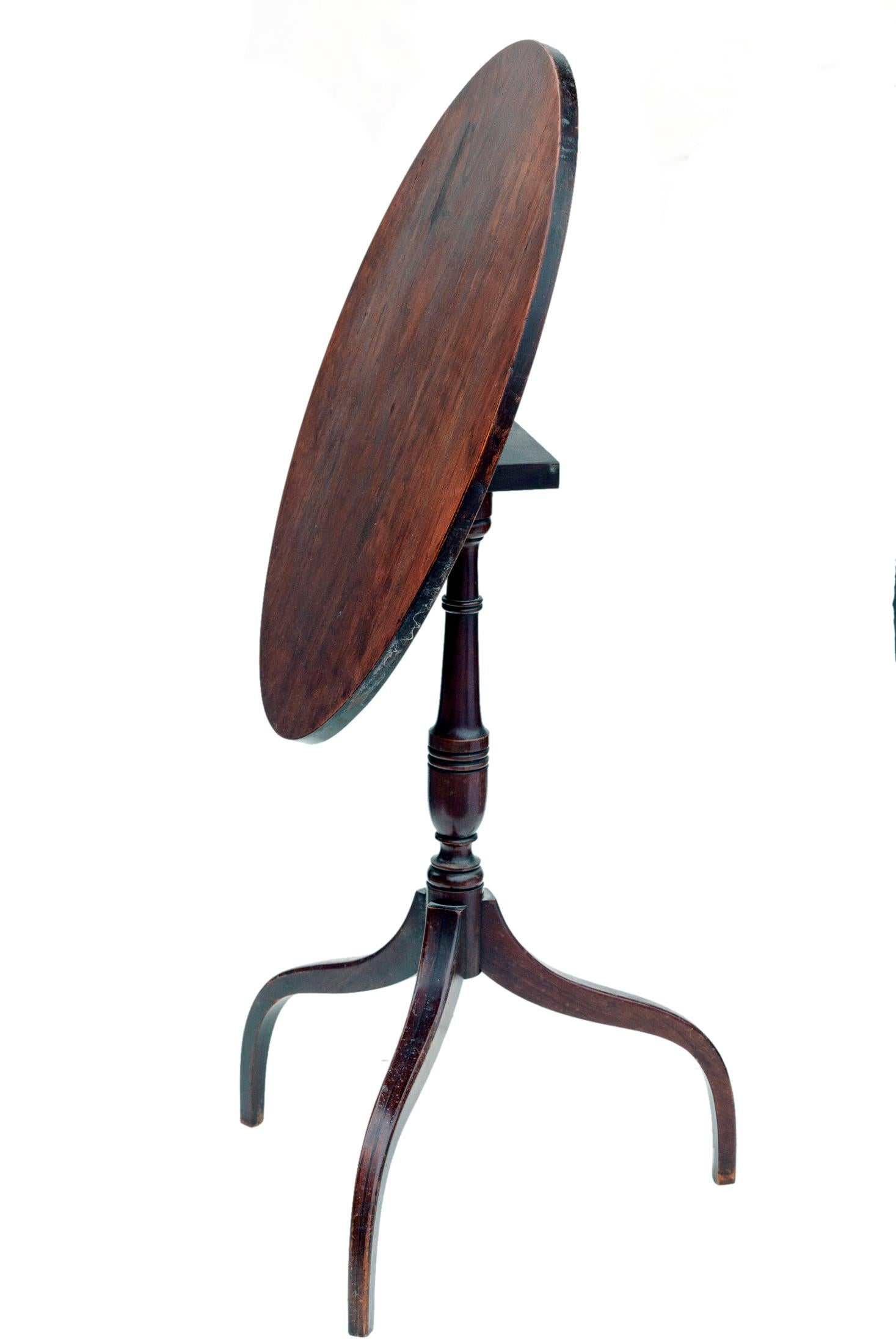 Graceful tapered oval tilt-top table. Tilt top rests on pedestal & tripod legs.
New finish to the top. Sturdy construction.
Fully functional.