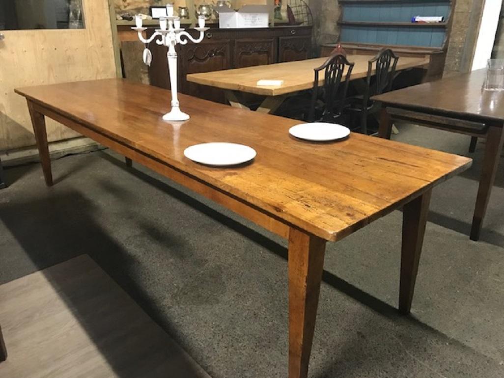 Antique cherry tapered leg 3m farmhouse table, with tapered legs and one drawer on the side. Very elegant and a good family table.



    