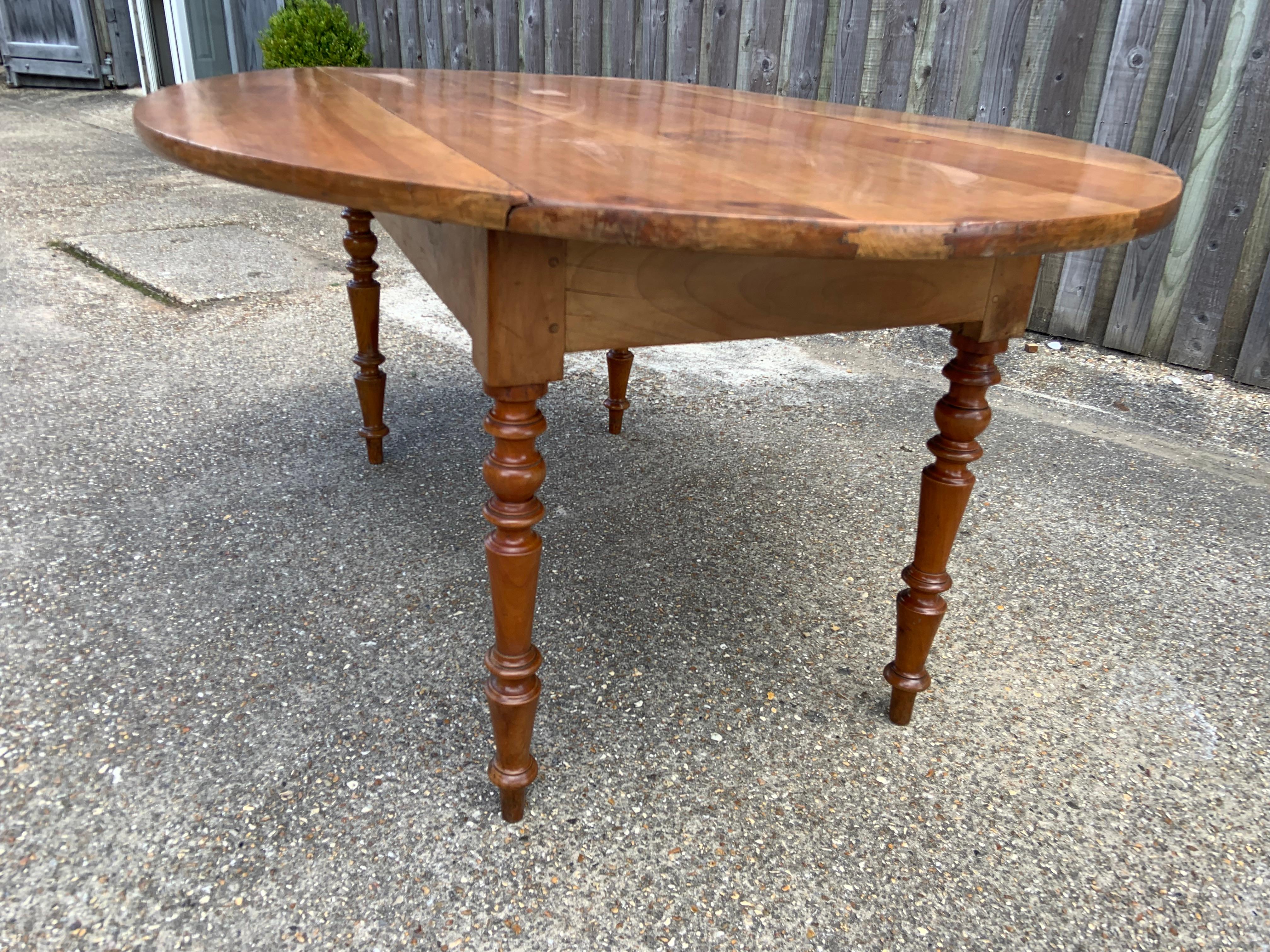 French Antique Cherry Tapered Leg Oval Drop Leaf Table For Sale