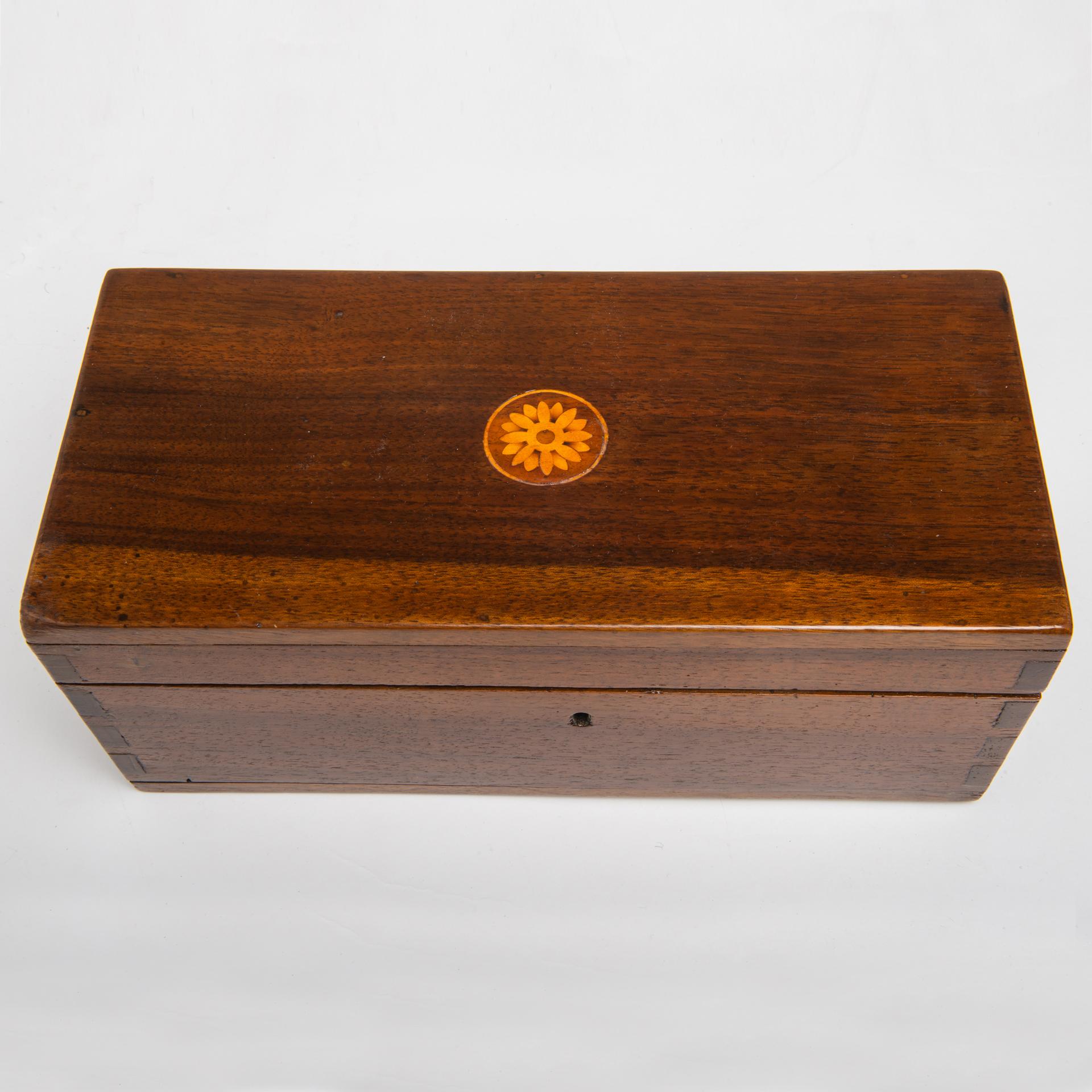 Antique walnut wooden boxes suitable for containing chess. You can choose among these four:
-the first has an inlaid flower on the lid  O/7400,  cm33x15xh.13,7 - € 400.
-the second has a silver S.Christopher - O/7403- cm34,8x23,8xh.7. € 400.
-the