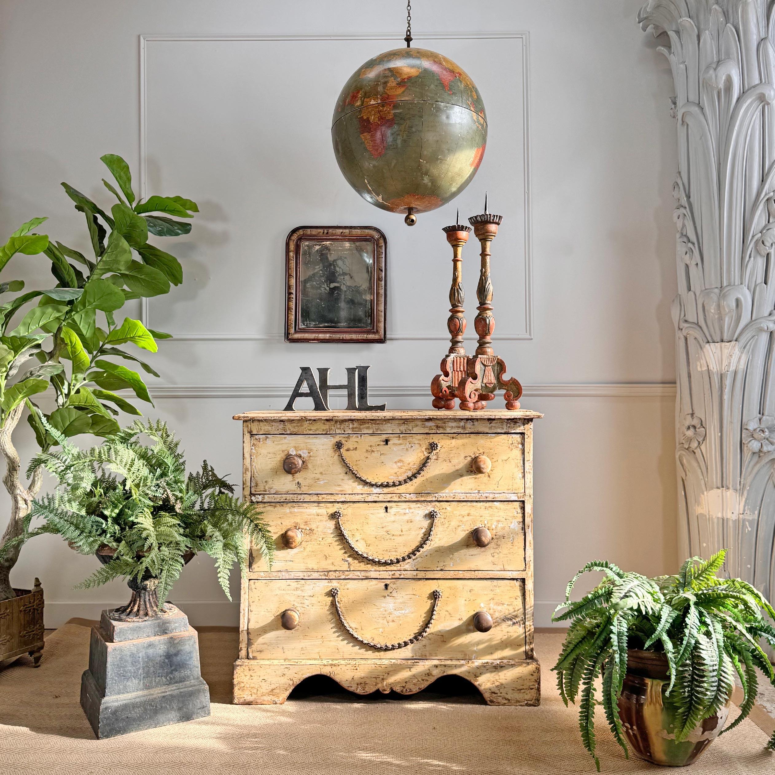 A beautiful and well proportioned late Victorian English chest of drawers, dry scraped with brass chain detail and escutcheon plates all present with original wood turned handles.



Very well presented and handsome chest, age related