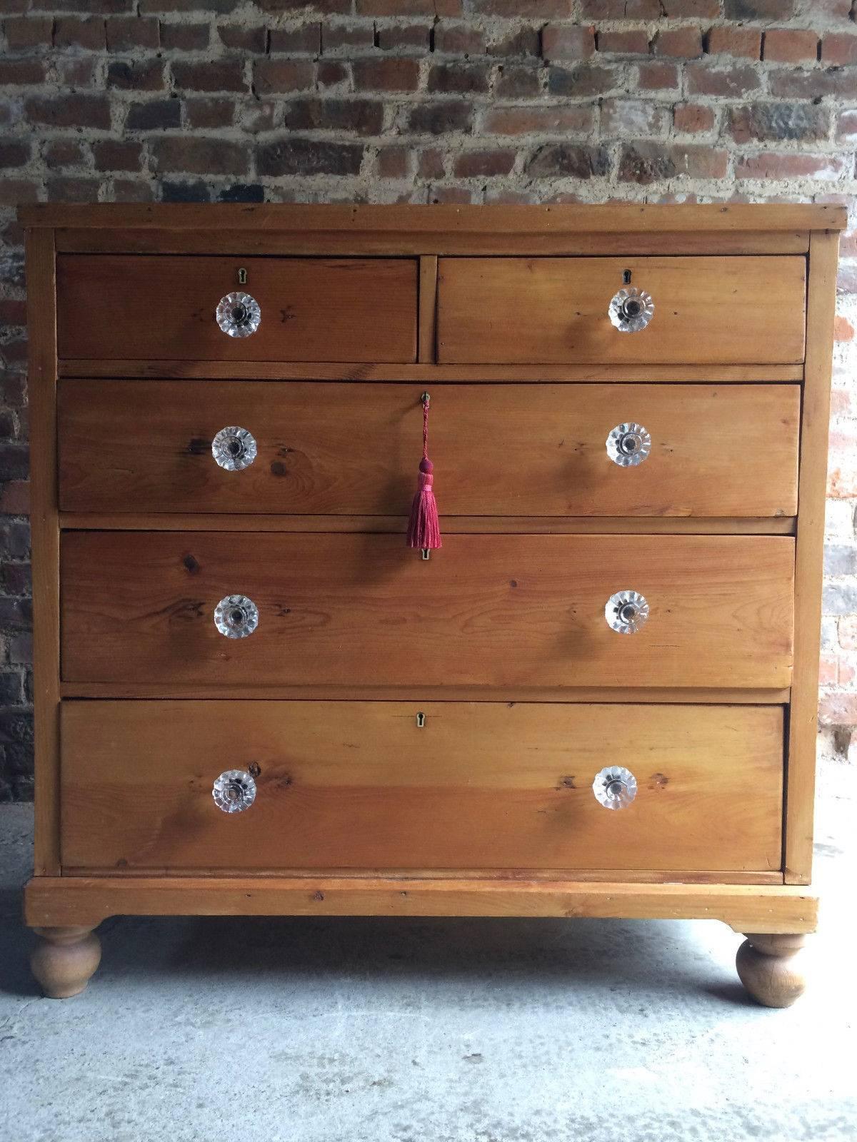 A wonderful antique 19th century Victorian stripped pine chest of drawers dresser dating to circa 1850, the rectangular top over two short and three large drawers all with glass knob handles and raised on four bun feet, comes with one non working