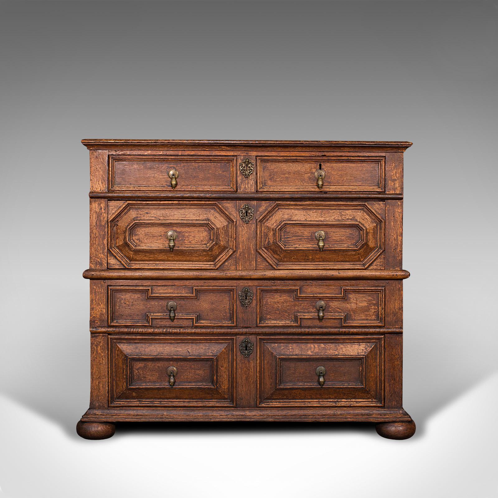 This is an antique two piece chest of drawers. An English, oak bedroom or hall tallboy cabinet, dating to the William III period of the late 17th century, circa 1700.

Fascinating example of late 17th century furniture
Displaying a desirable aged
