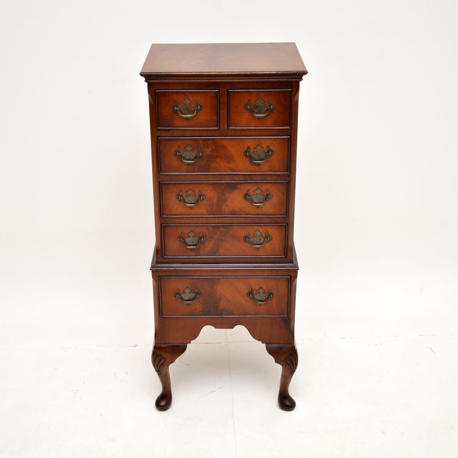 A smart and useful antique chest of drawers on legs. This was made in England, it dates from around the 1930-50’s.

It is a very useful size, it is slim and taking up very little space, yet offering plenty of storage in the many drawers. The wood