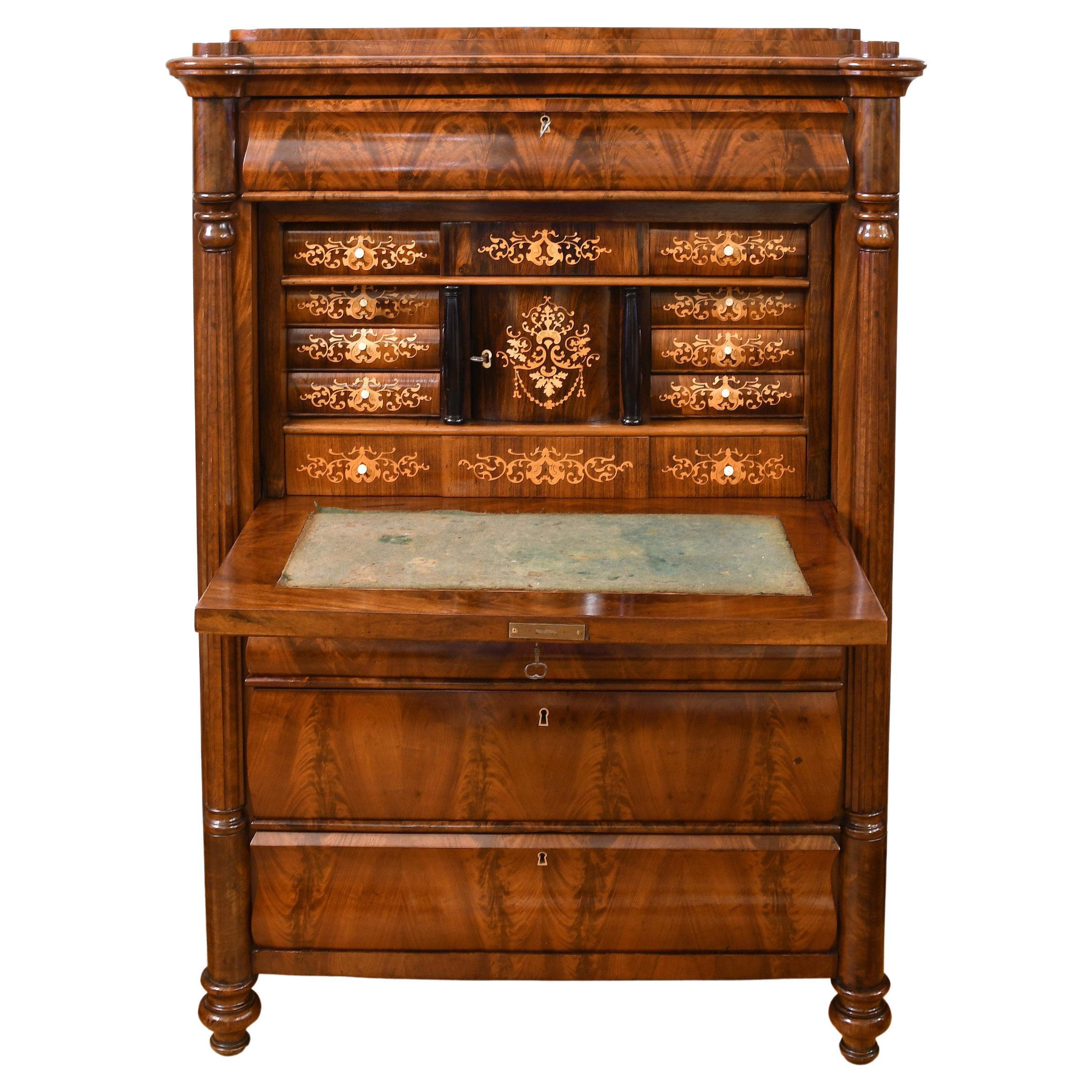 A very handsome Danish Christian VIII secretary in fine West Indies (also known as Cuban) mahogany with a stepped pedestal top over a single drawer above a fall-front desk, and followed by three storage drawers of graduated depths. Desk interior is