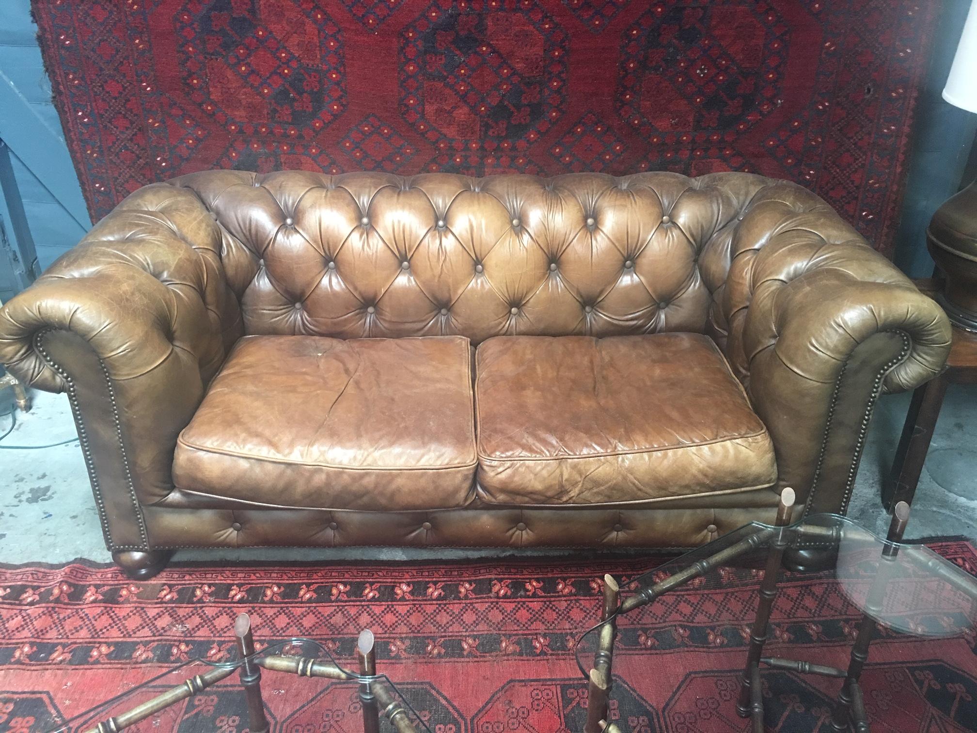 Beautiful Classic English chesterfield sofa in leather with near perfect patina.