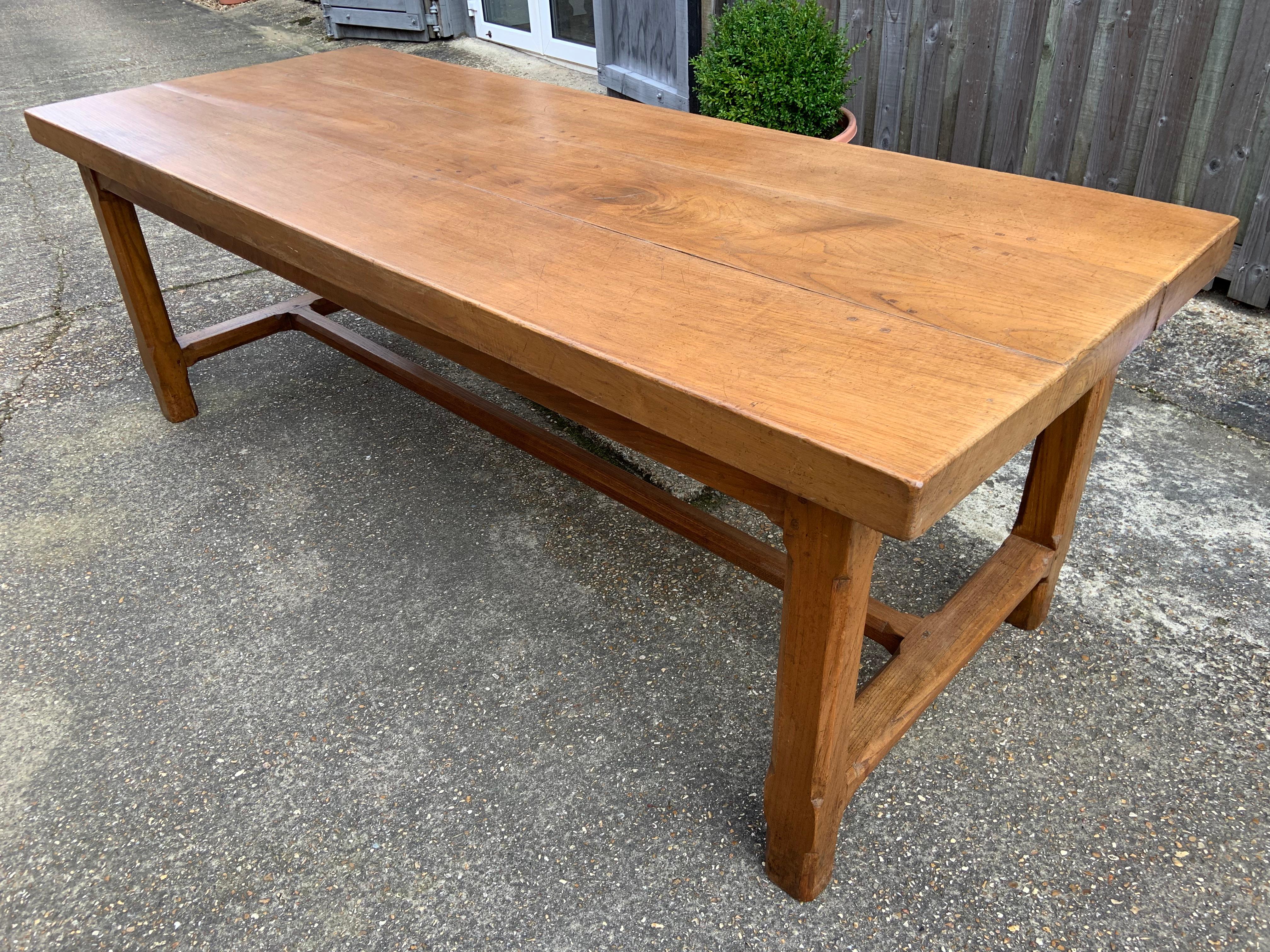 Antique Chestnut farmhouse table that sits on square legs with a centre stretcher and has one side drawer. The three plank top has lovely colour. Plenty of leg room at 24.5