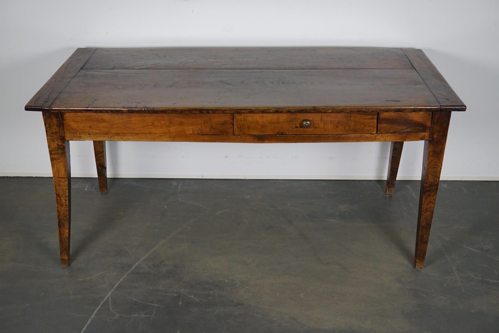 This French farmhouse table was made between 1840 and 1860 in France. It retained a very nice rich patina over the years.