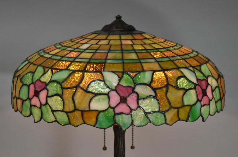 Antique Chicago Mosaic Co. leaded glass table lamp with floral designs. Granite back glass. Shade is 18