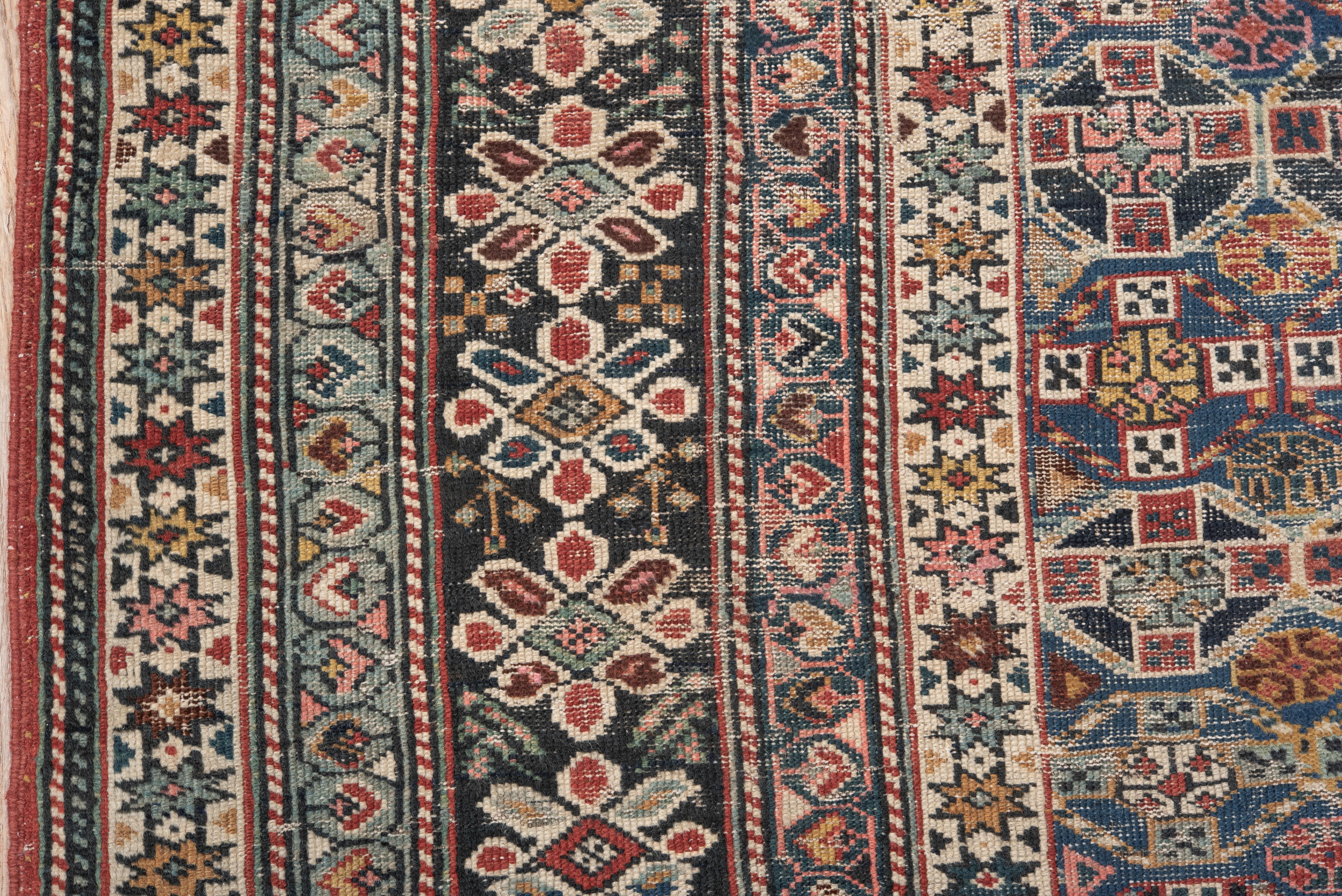 Wool Antique Chichi Caucasian Rug with Pinks and Blue and Purple and Reds in Floral For Sale