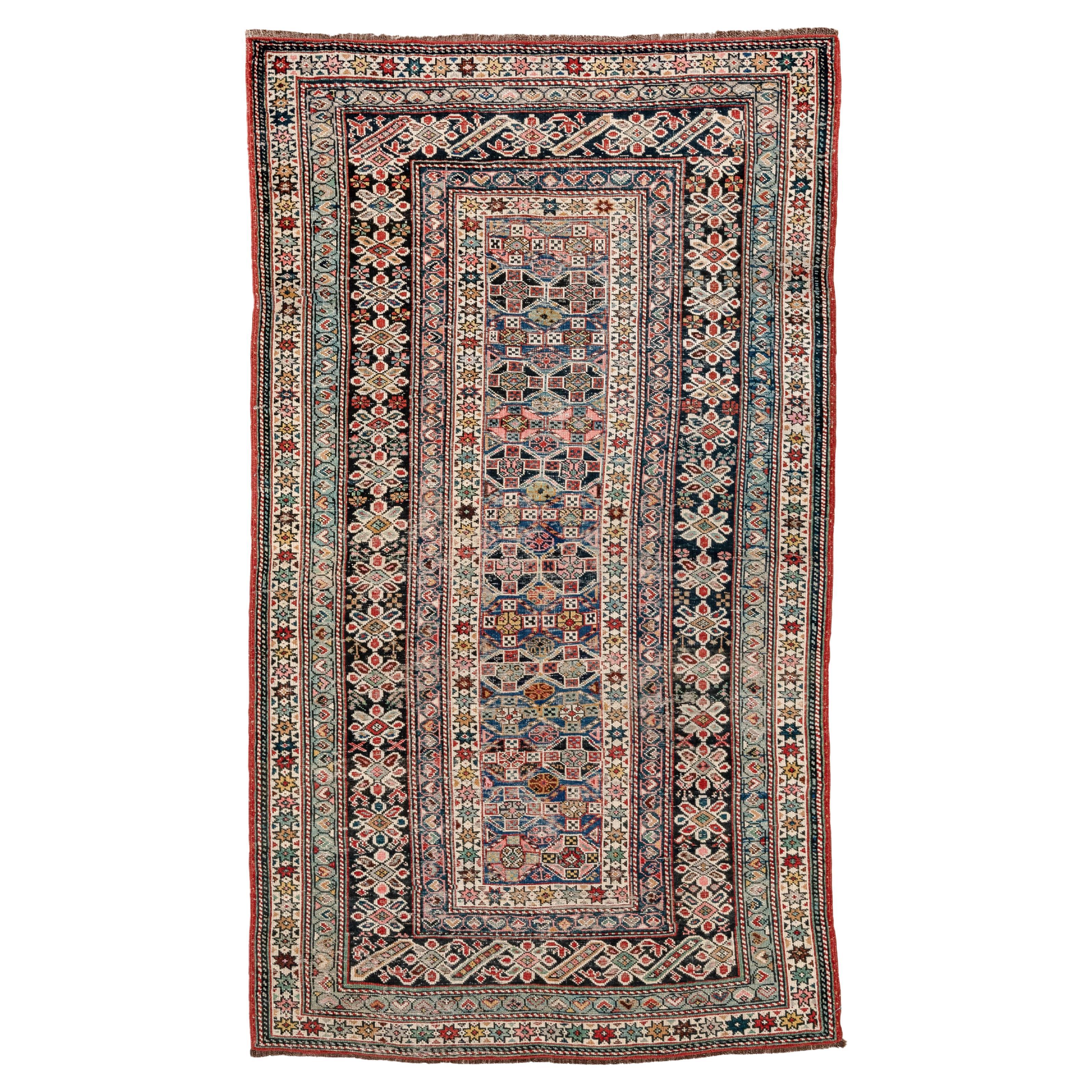 Antique Chichi Caucasian Rug with Pinks and Blue and Purple and Reds in Floral For Sale