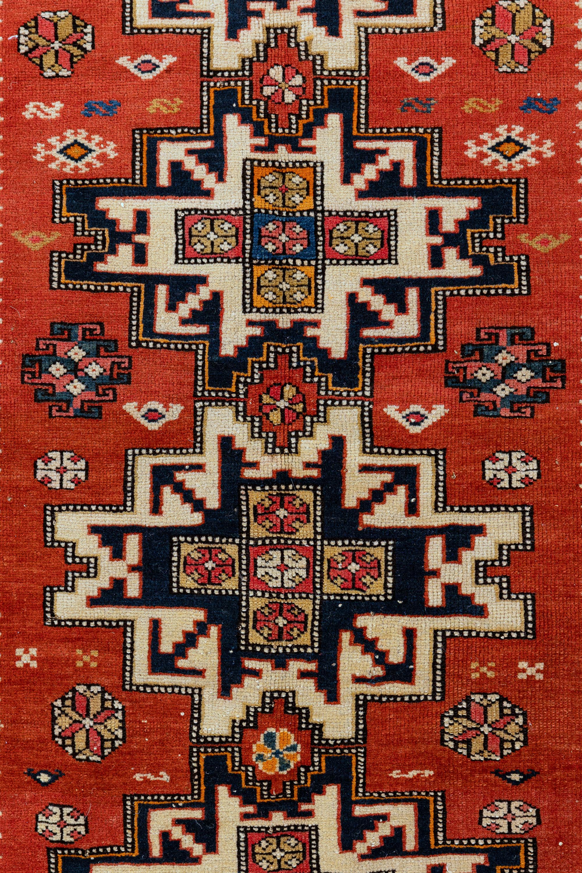Chichi – Kuba, Northeast Caucasus

This vibrant Caucasian Chichi rug was made in modern-day Azerbaijan’s Kuba (Quba) district. Six lesghi stars spread across the bright red background of the carpet. On the white background, small squares make up a