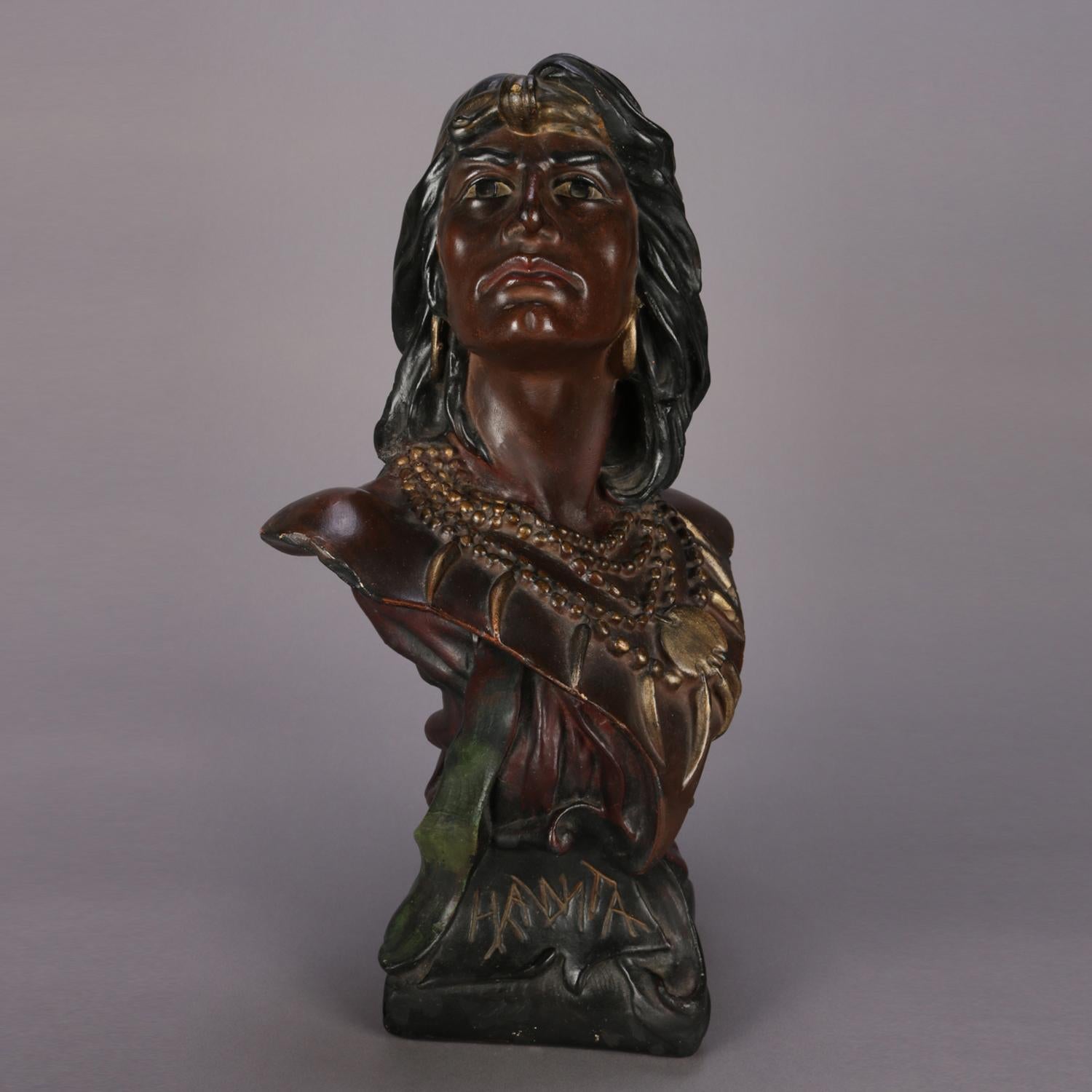 An antique and large hand painted and gilt chalkware portrait sculpture depicts bust of Native American Indian Chief or Brave Hawata, titled 