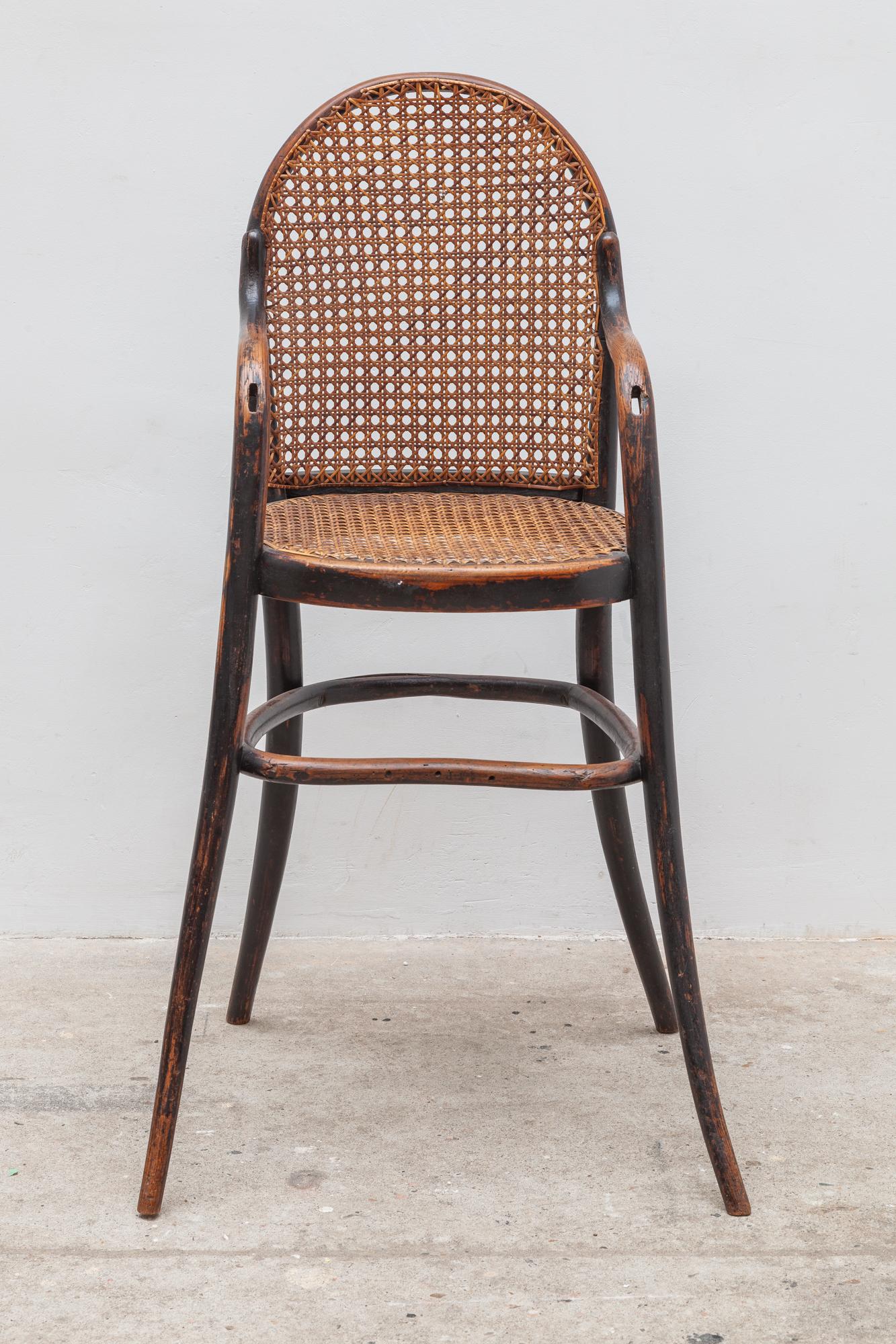 Antique child’s chair of Thonet. Elegant bent wood frame with hooped legs. The caning on the seat and
back is in great condition for it’s age. Dimensions: 50W x 90H x 32D cm, Seat: 53 cm high.