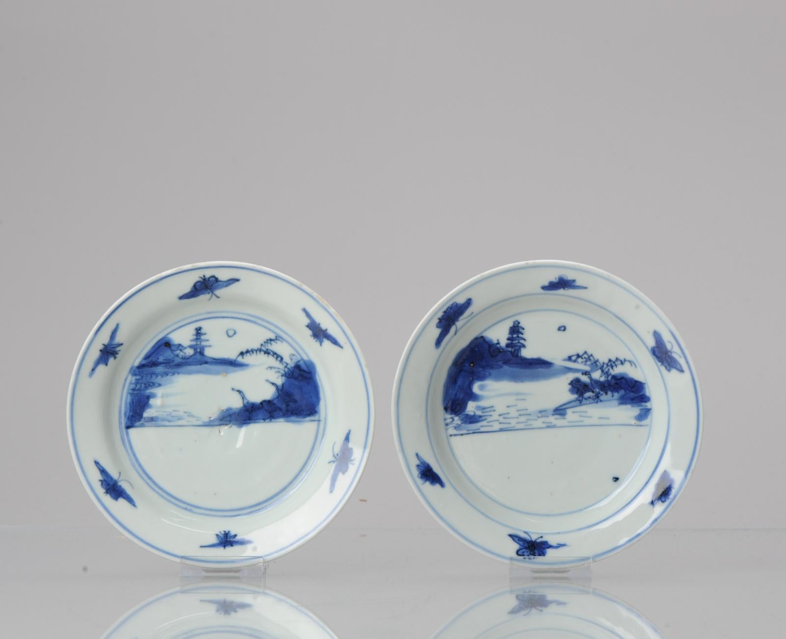 Description
A very nicely decorated Late Ming Blue and White Porcelain Dish with a landscape scene situated in two concentric circles with Ducks/Geese under a pine tree in a mountainious landscape with a pagode in the background. The moon at te