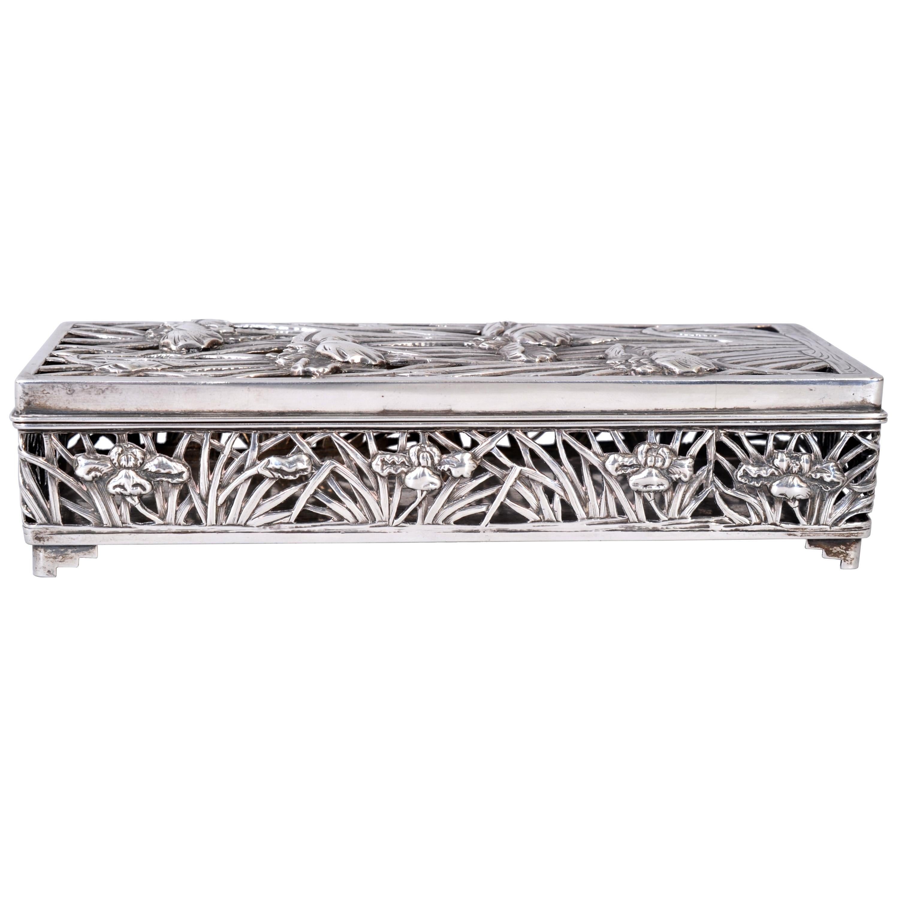 A magnificent antique Chinese export silver box/pot-pourri by Wang Hing, circa 1880.
The hinged lidded box is very finely decorated with repousse pierced work on the lid and sides, with water lilly decoration, fully marked to the base and raised on