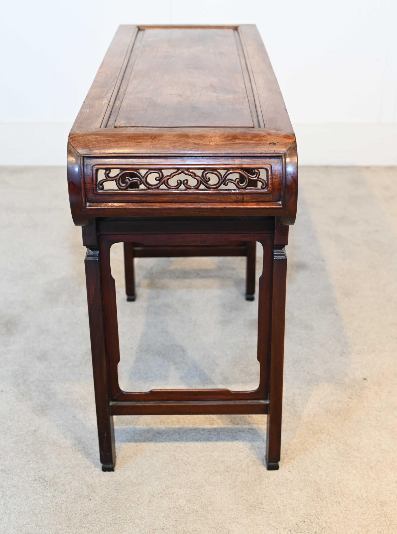 You are viewing an on trend Chinese altar table in hardwood
Circa 1860 such a great look with the intricately carved apron with Asian floral motifs
Top curves around and this would look great with a pair of Chinese vases displayed on top
If you are