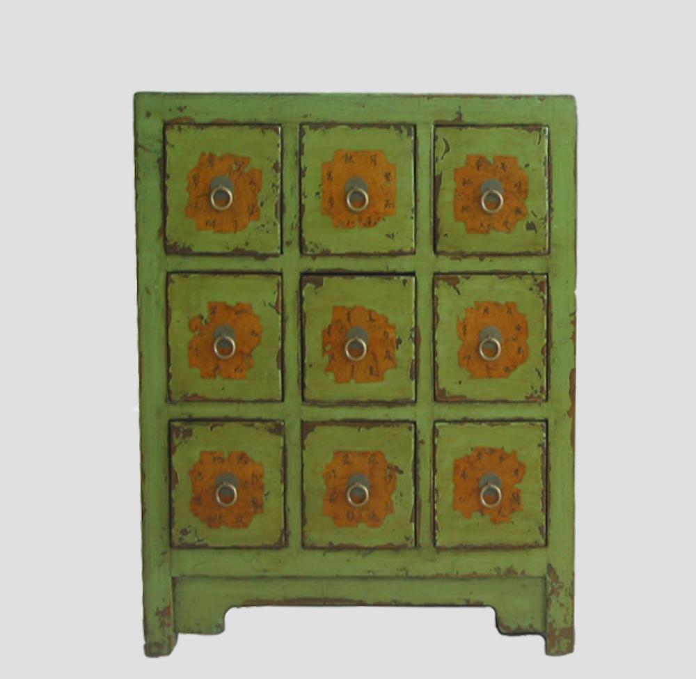 This apple green antique Chinese cabinet was once used to store medicinal herbs in a Chinese apothecary. The name of herb medicines were written on each drawer. The old labels on the drawers were intact. This traditional Chinese medicine cabinet is