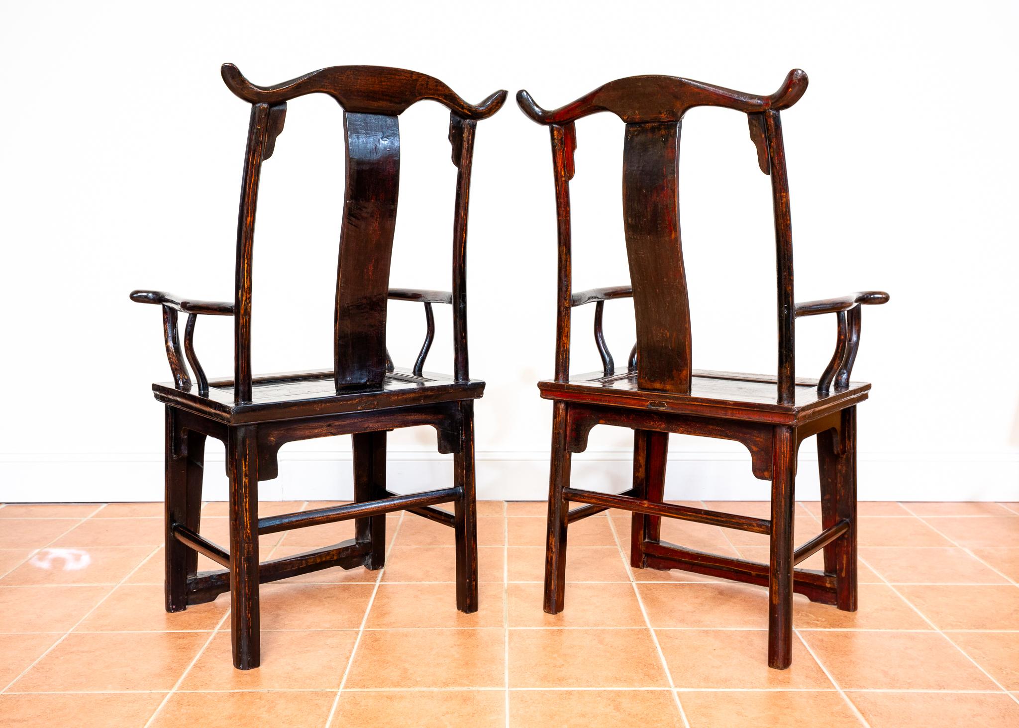 Hand-Carved Antique Chinese Armchairs Pair Official Hat Yoke Back Carved Motifs Lacquered For Sale