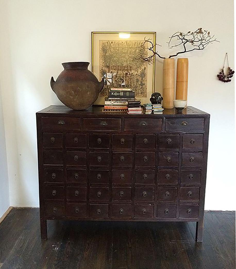 This 19th-century chest was originally used by a Chinese pharmacy to organize and store herbal medicines. A statement piece brilliantly constructed with mortise and tenon joinery, it has 39 drawers, each beautifully dovetailed together. Drop-ring