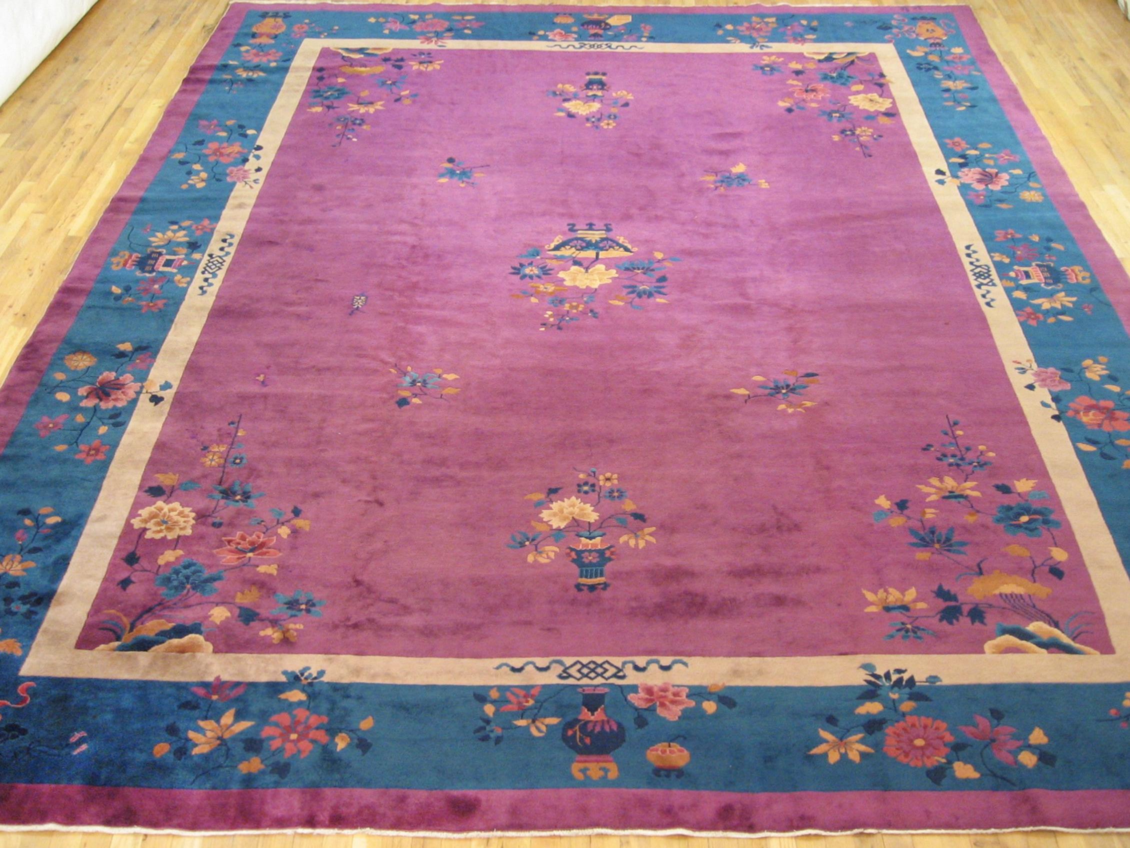 Antique Chinese Art deco rug, room size, circa 1920.

A one-of-a-kind antique Chinese Mandarin oriental carpet, hand-knotted with medium thickness wool pile. This beautiful rug features art deco motifs allover a large purple red open field, with a