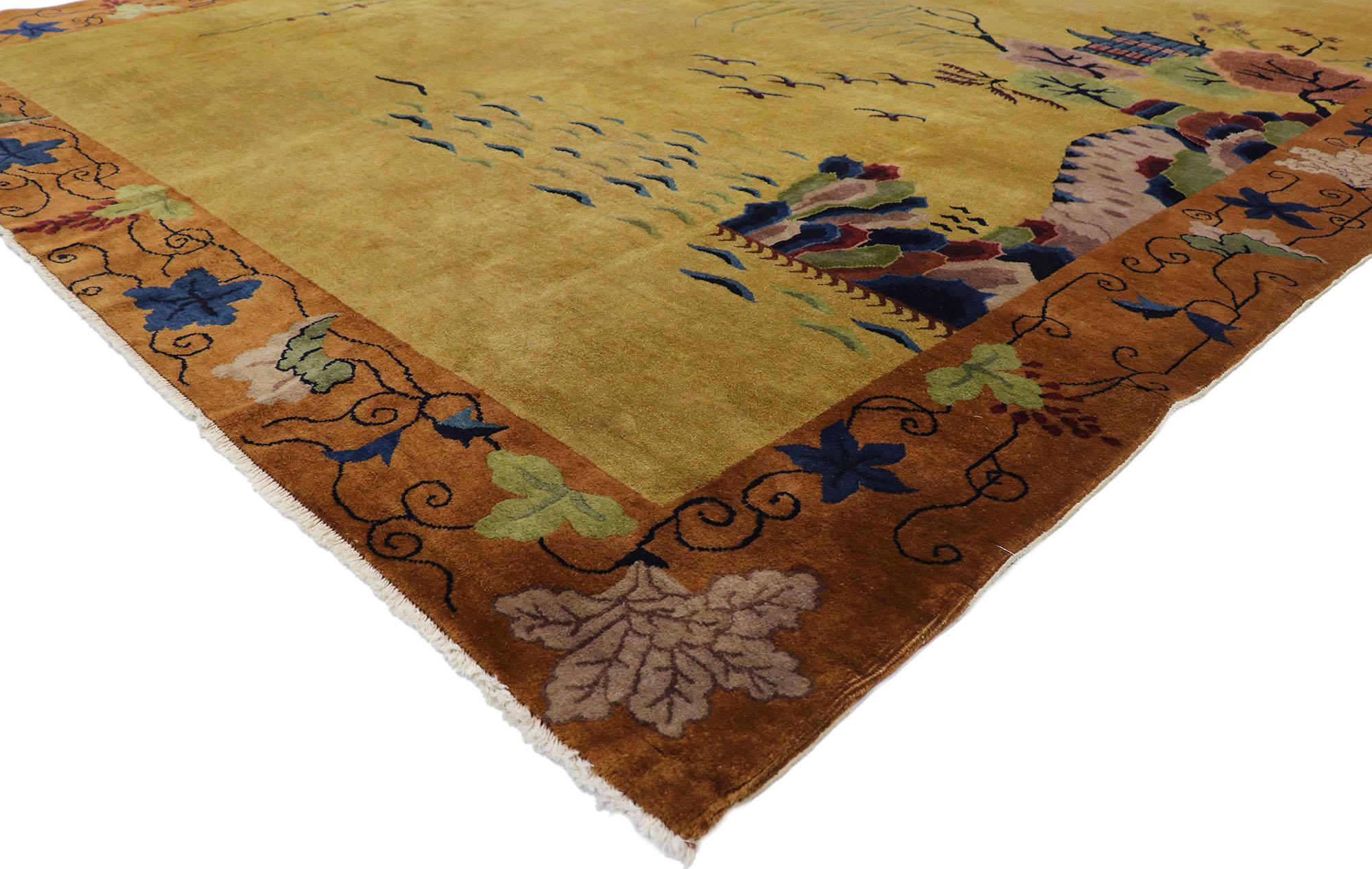 77625 Antique Chinese Art Deco Pictorial rug with Qing Dynasty style. This hand knotted wool antique Chinese Art Deco rug features a color-blocked field and border scheme festooned with glorious sprays of flowers and a striking landscape scene