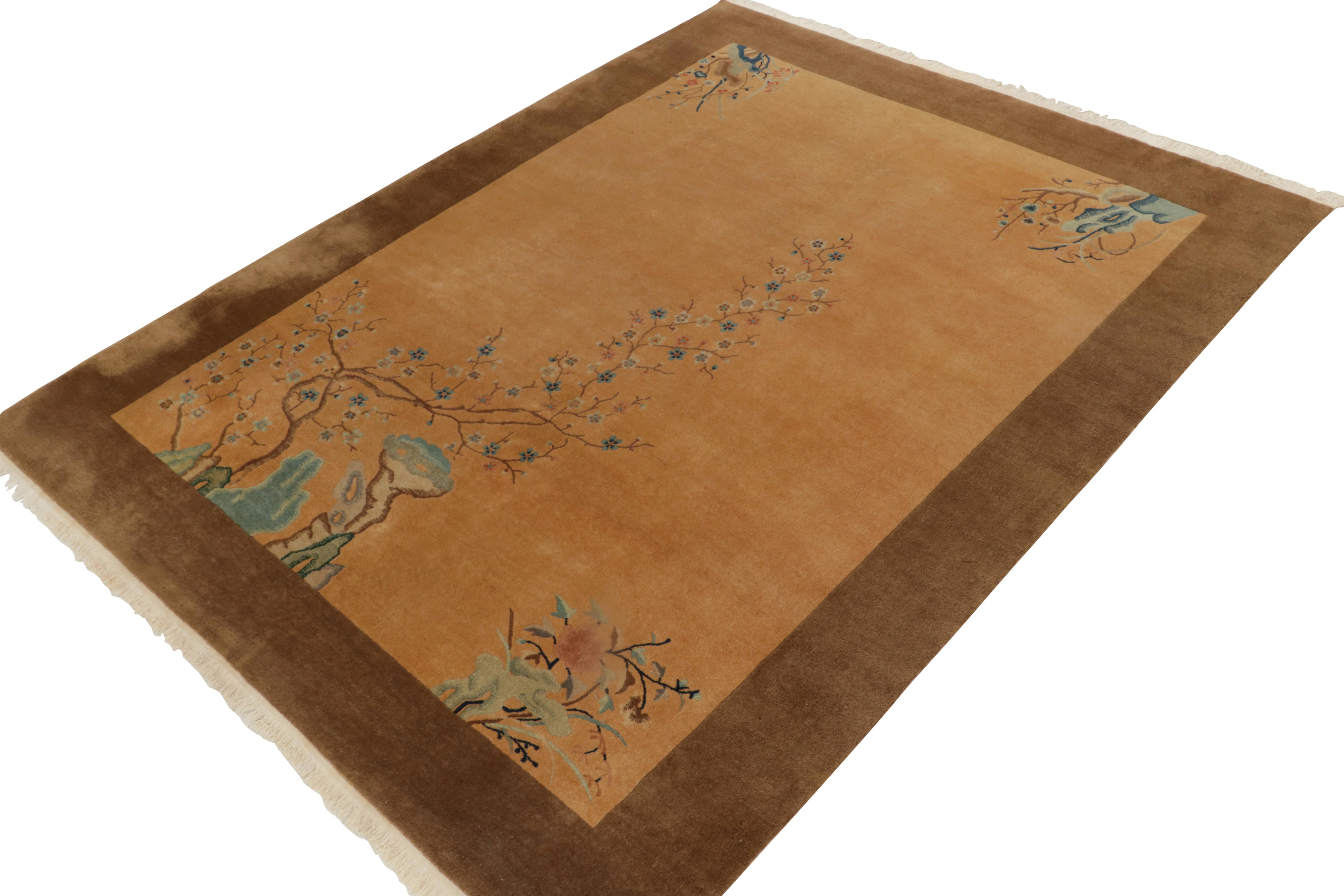 Hand-knotted in wool, an antique 9x12 Chinese Art Deco rug joining Rug & Kilim’s repertoire of coveted 1920s masterpieces. This interpretation of the classic style enjoys a brilliant gold background, with beautiful beige-brown blue playing with