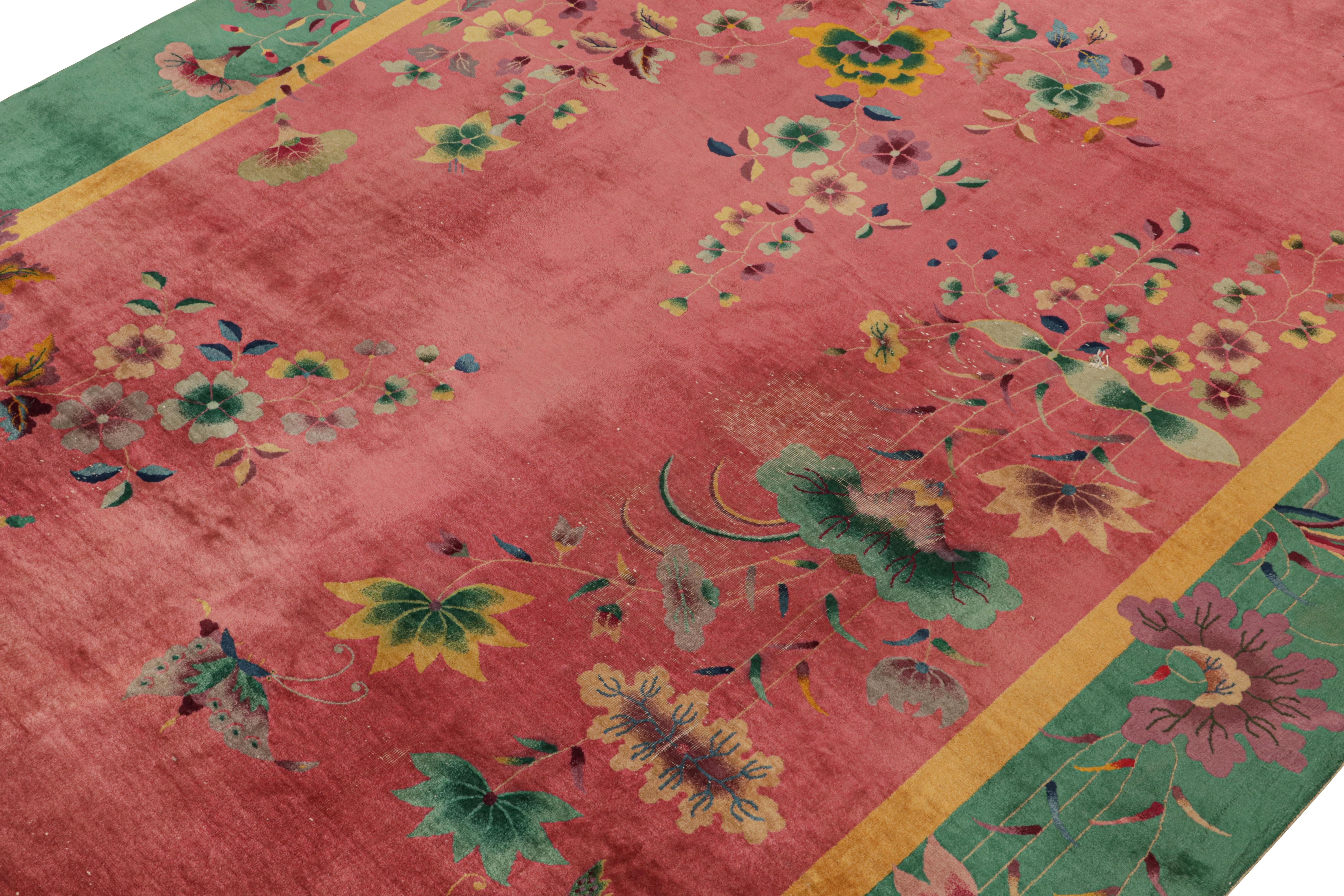 Hand-knotted in wool circa 1920-1930, this 10×15 antique Chinese Art Deco rug is a rare curation from the Rug & Kilim Collection. 

On the Design:

This Nichols-era period piece style rug boasts finely detailed floral patterns, uniting a pink field