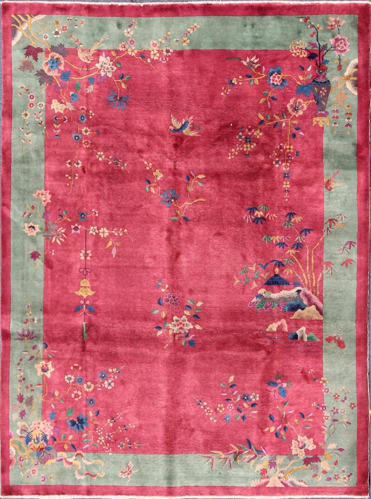 Antique Chinese Art Deco Rug in Red and Green.
This gorgeous antique Art Deco Chinese carpet has an incredibly rich palette of complementary colors incorporated into a captivating multiplicity of delightful objects of nature. Dazzling flora,